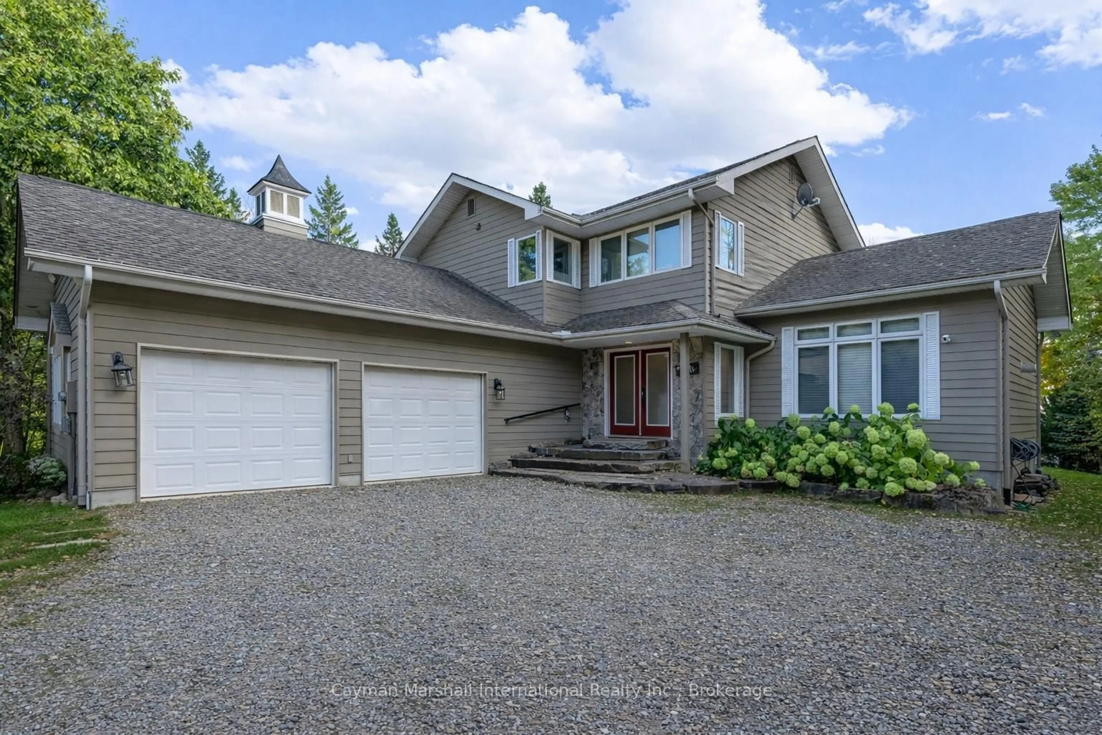 Home with vinyl exterior material, street for 1079 Sawmill Lane, Lake of Bays Ontario P1H 2J6