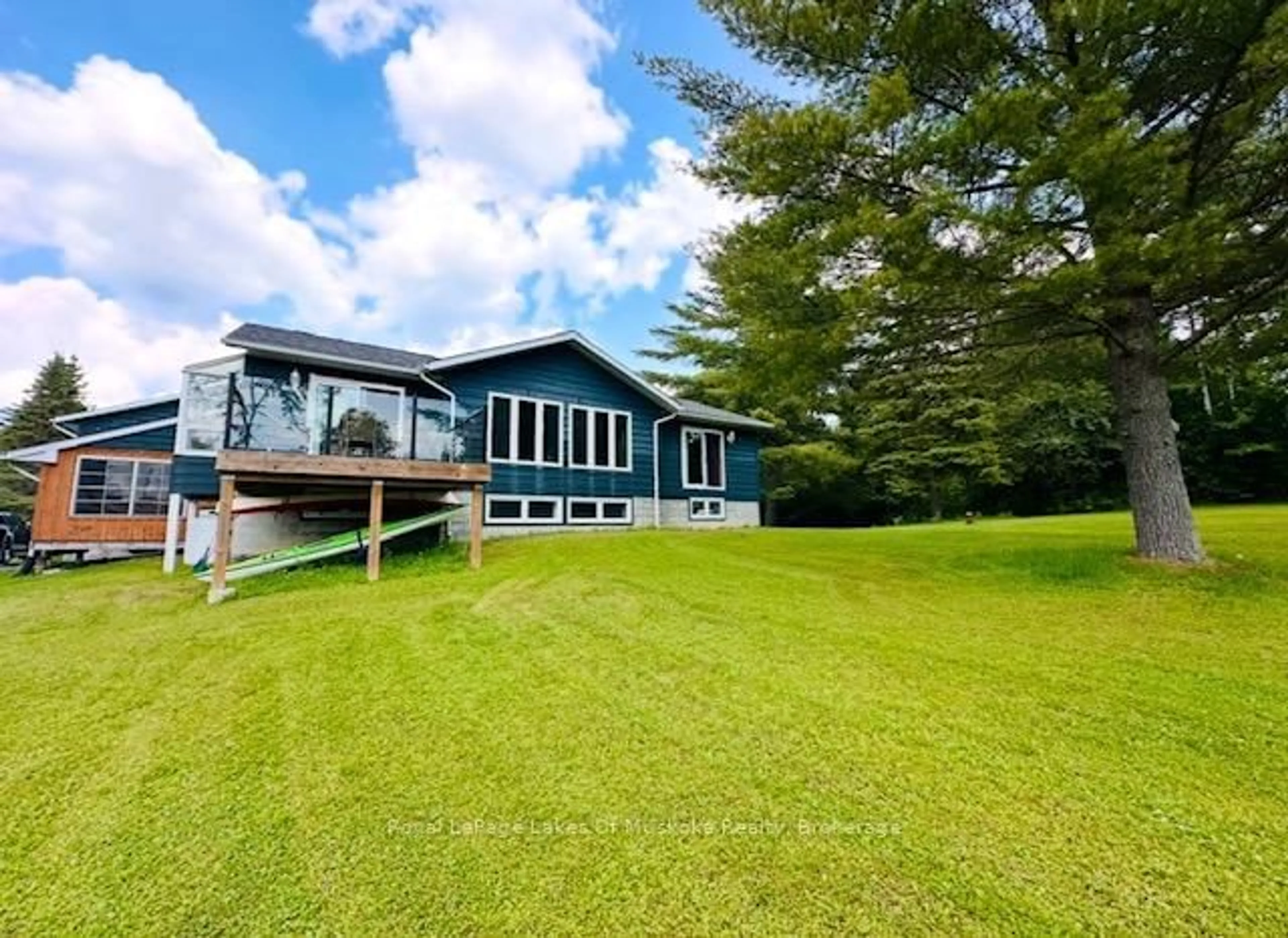 A pic from outside/outdoor area/front of a property/back of a property/a pic from drone, water/lake/river/ocean view for 96 North St, Magnetawan Ontario P0A 1P0