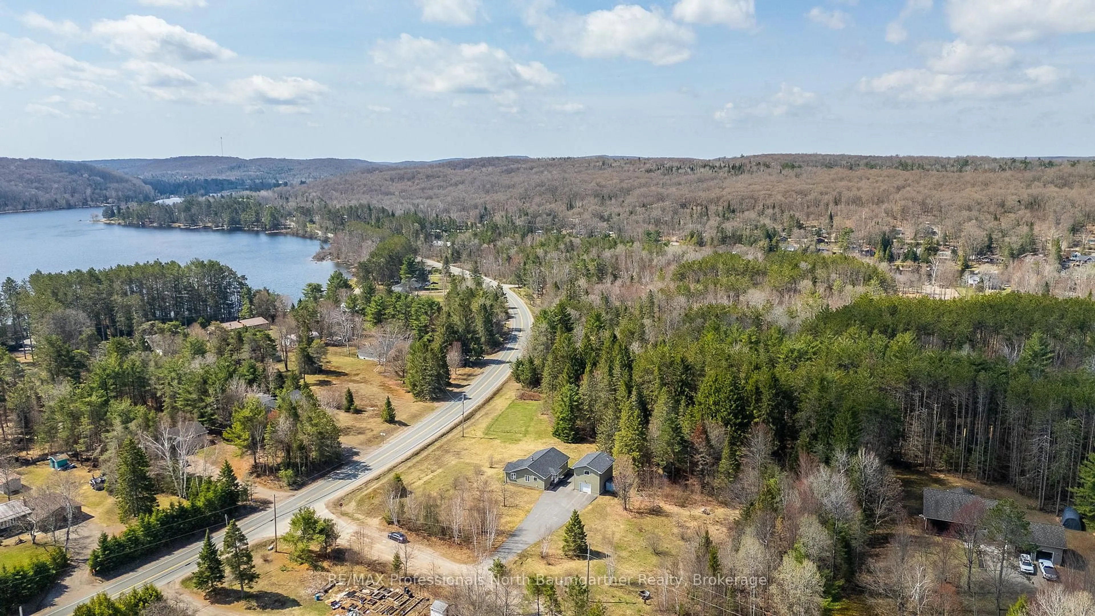 A pic from outside/outdoor area/front of a property/back of a property/a pic from drone, water/lake/river/ocean view for 1009 Outram Rd, Highlands East Ontario K0L 3C0
