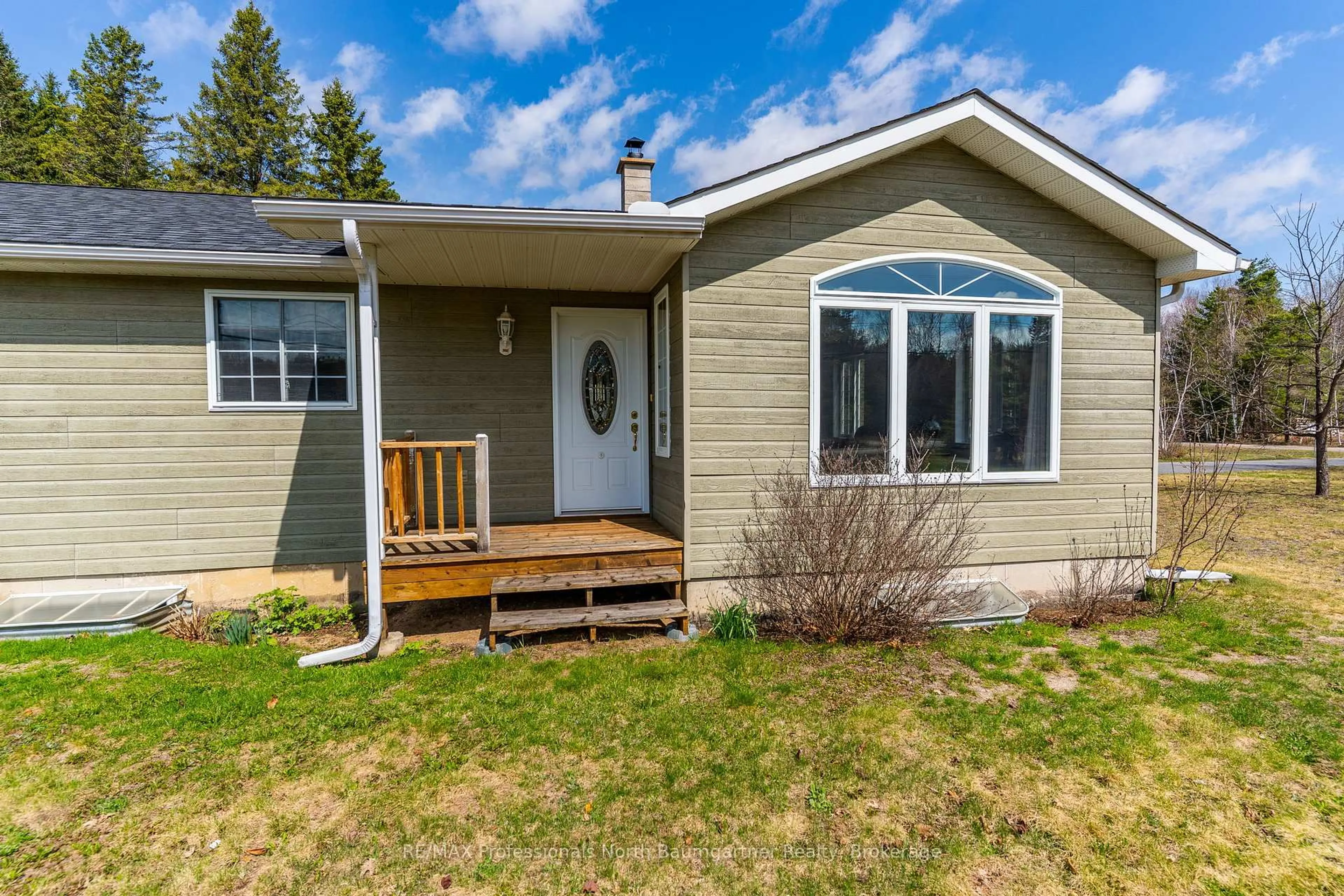 Home with vinyl exterior material, street for 1009 Outram Rd, Highlands East Ontario K0L 3C0