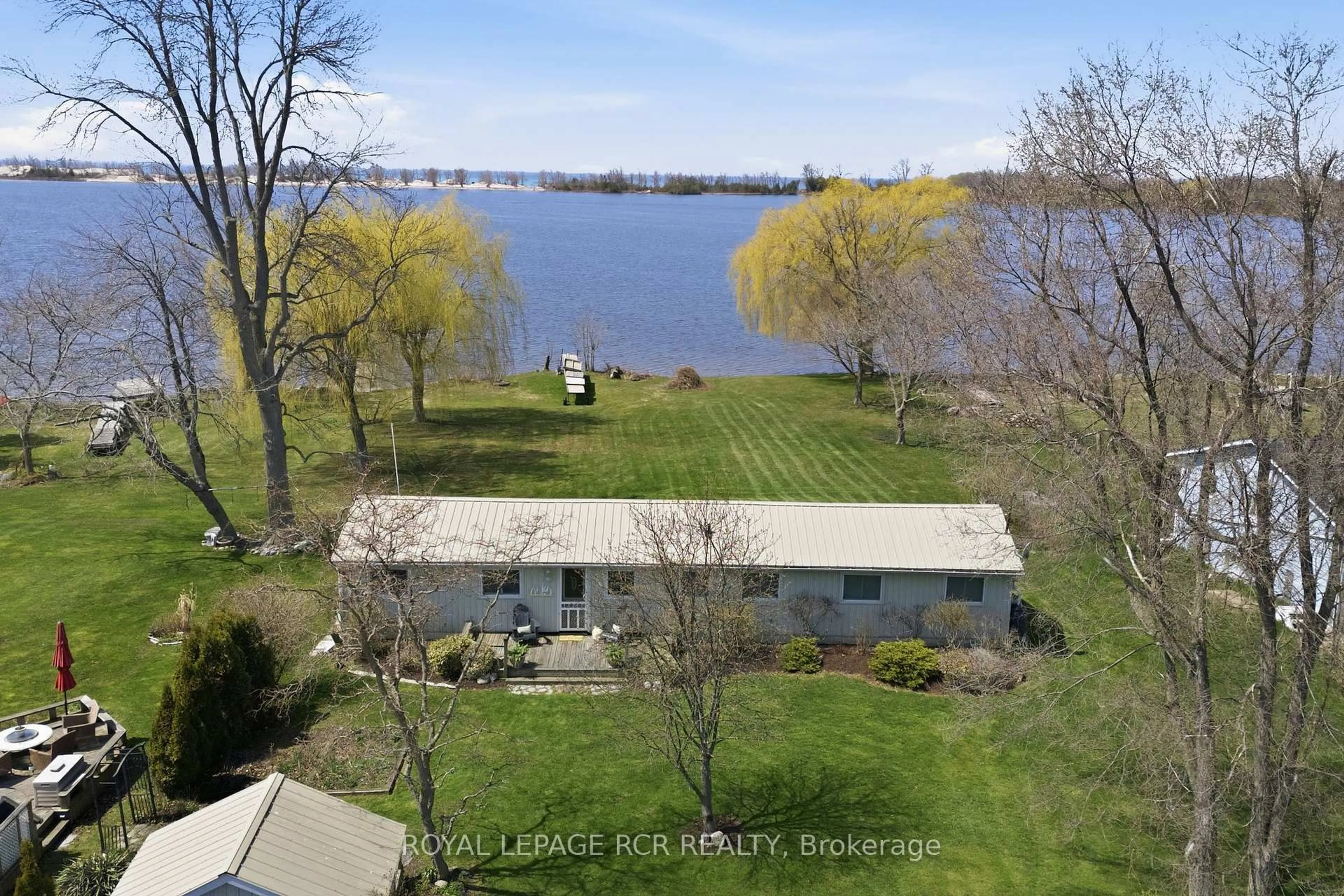 A pic from outside/outdoor area/front of a property/back of a property/a pic from drone, water/lake/river/ocean view for 130 Ould Dr, Prince Edward County Ontario K0K 1T0