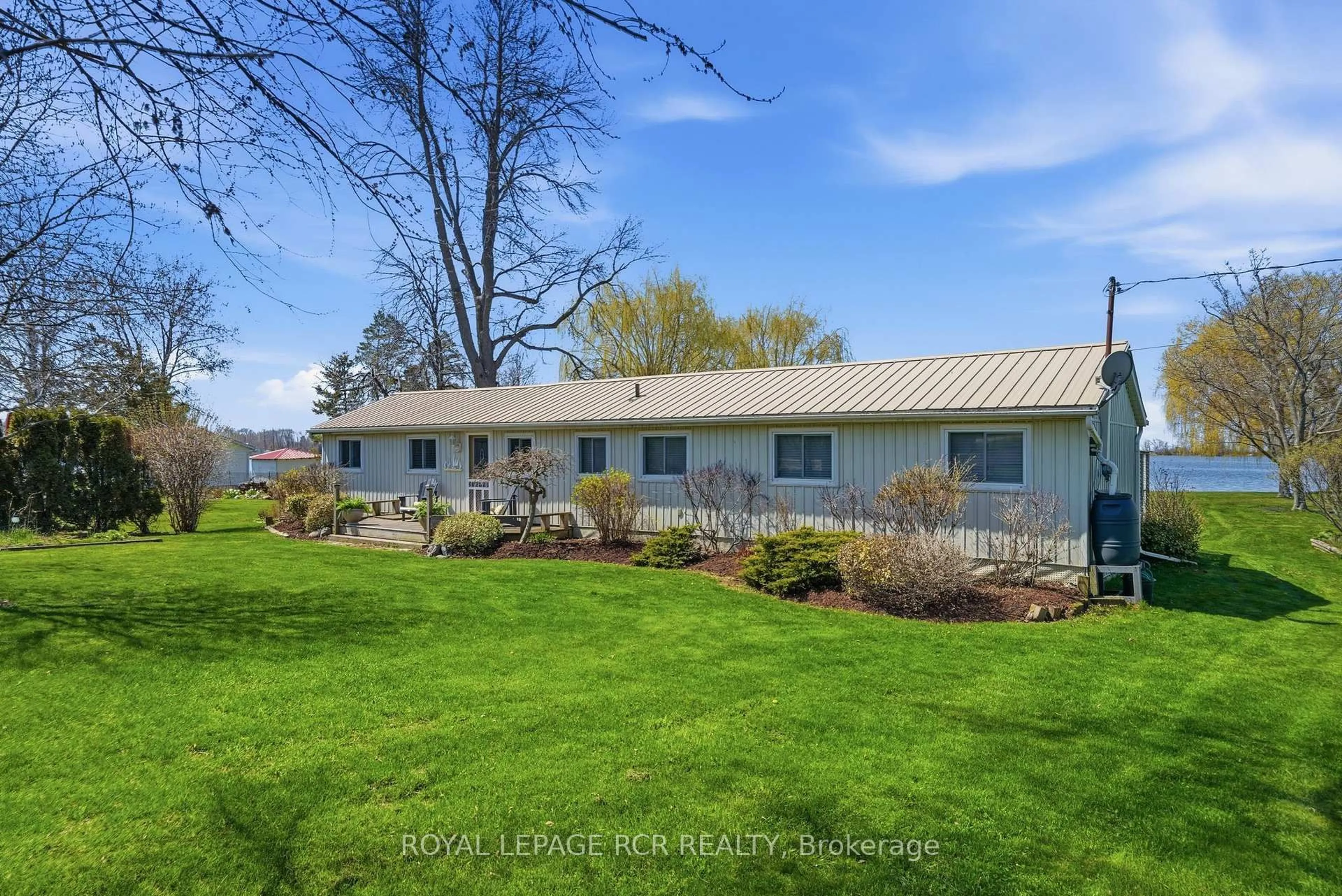 A pic from outside/outdoor area/front of a property/back of a property/a pic from drone, water/lake/river/ocean view for 130 Ould Dr, Prince Edward County Ontario K0K 1T0