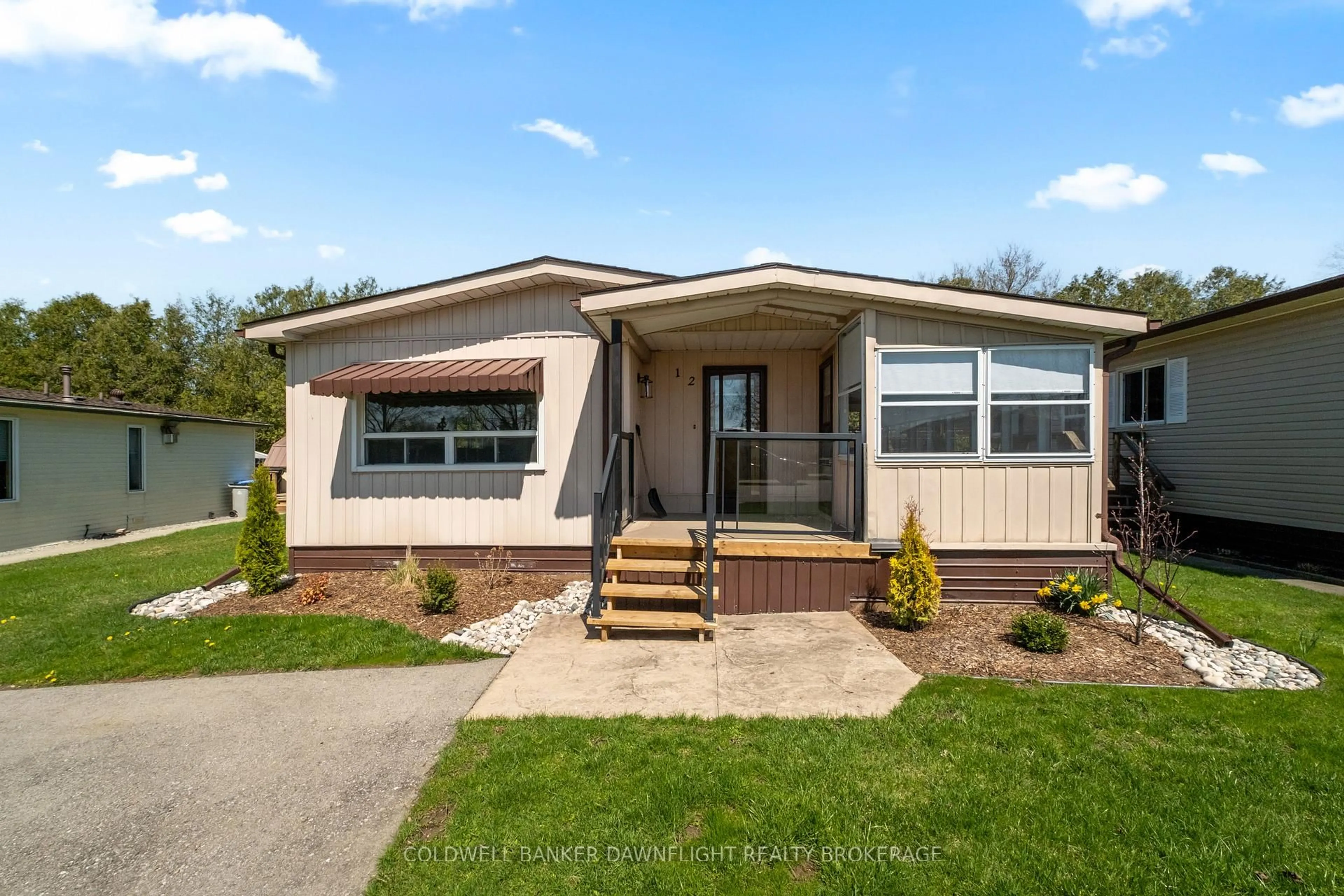 Home with vinyl exterior material, street for 12 Redford Dr, South Huron Ontario N0M 1S3