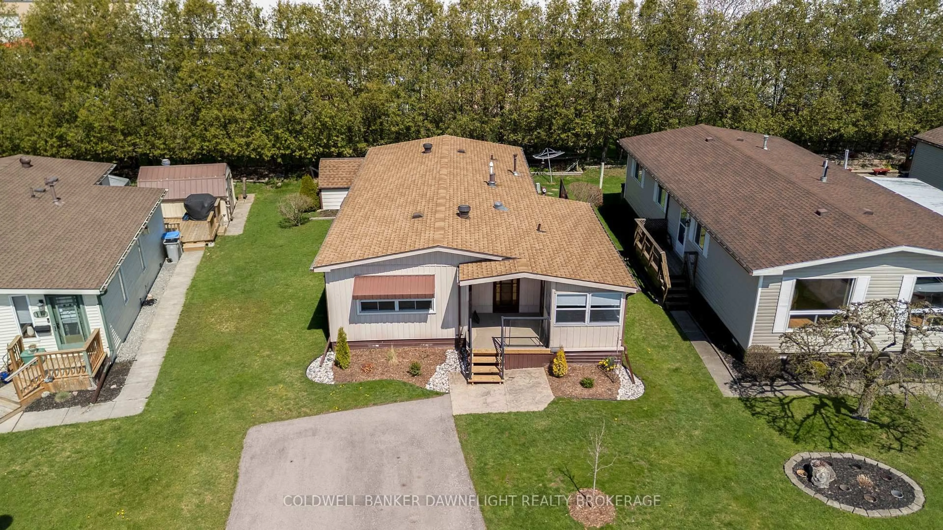 A pic from outside/outdoor area/front of a property/back of a property/a pic from drone, street for 12 Redford Dr, South Huron Ontario N0M 1S3