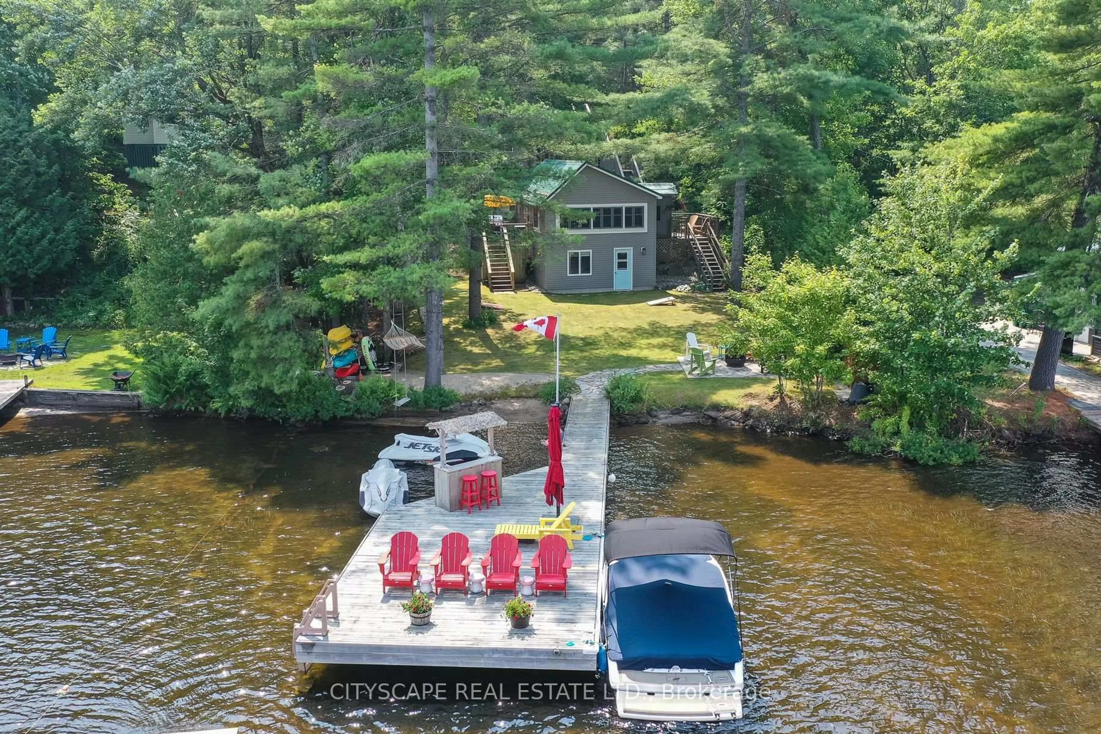 A pic from outside/outdoor area/front of a property/back of a property/a pic from drone, water/lake/river/ocean view for 1100 Hewitt St #2, Gravenhurst Ontario P1P 1R3