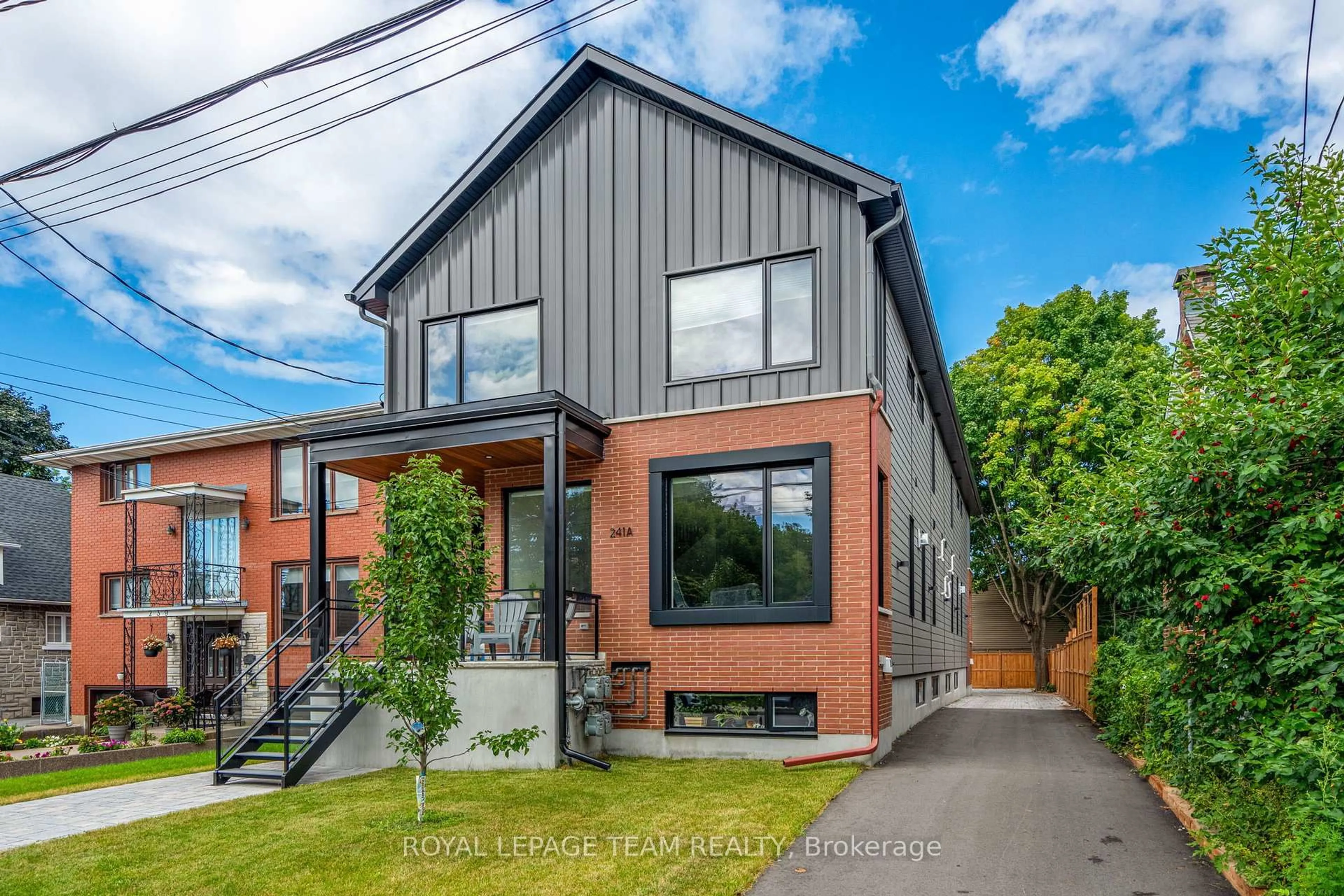 Home with brick exterior material, street for 241 Breezehill Ave #B/B2, Ottawa Ontario K1Y 2J2