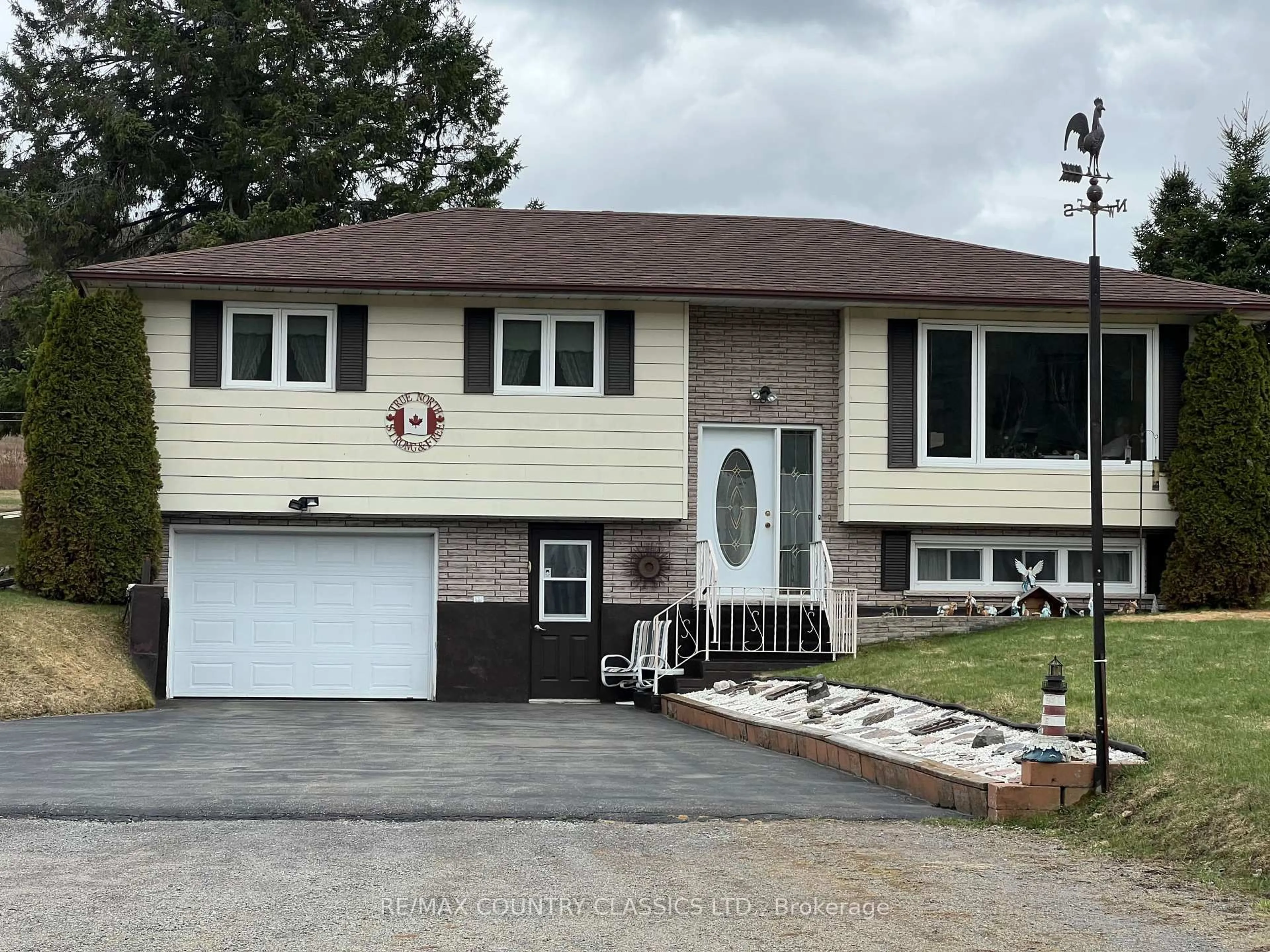 Home with vinyl exterior material, street for 3559 South Baptiste Lake Rd, Highlands East Ontario K0L 2A0