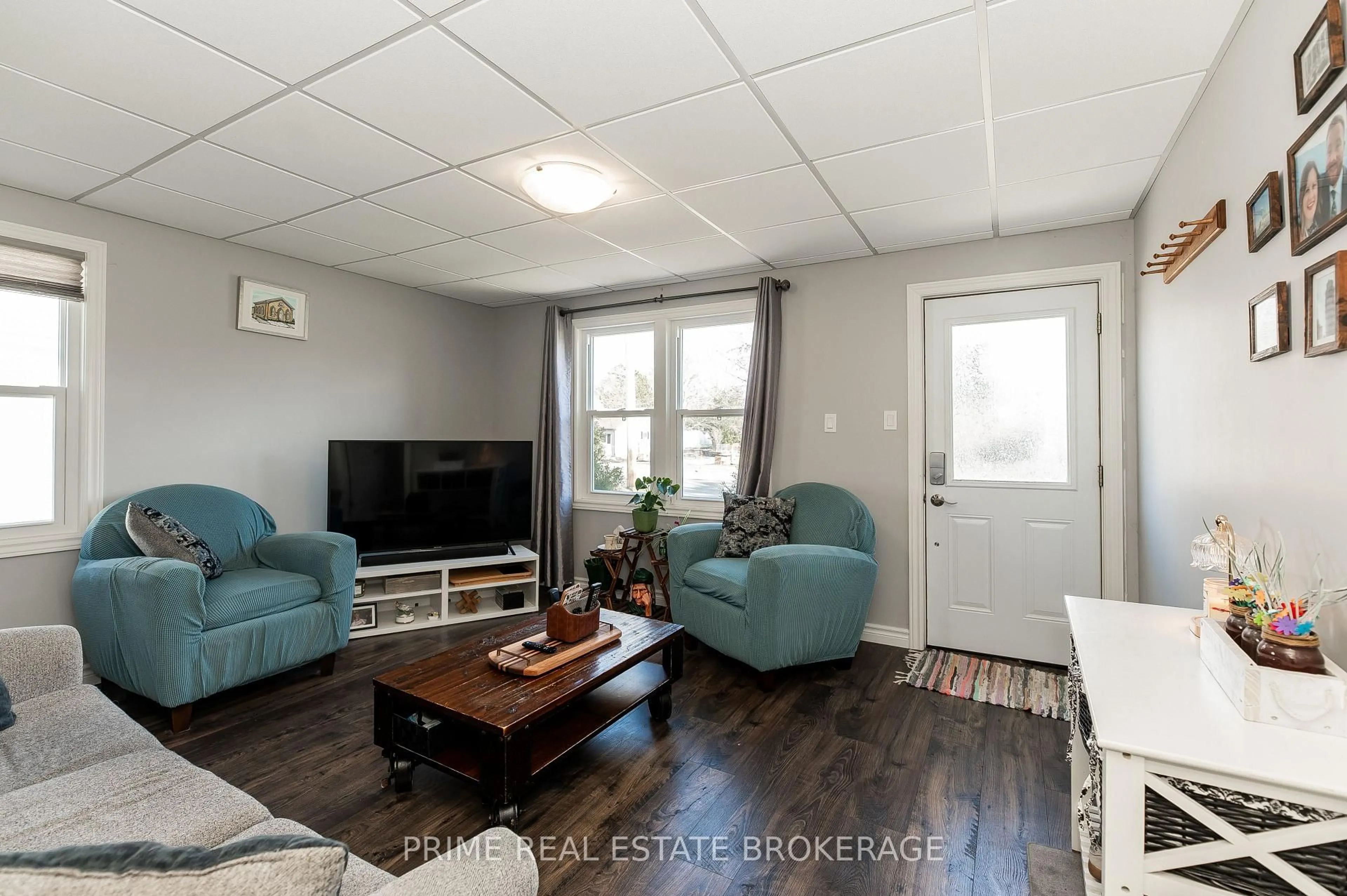 Living room with furniture, wood/laminate floor for 139 Main St, West Elgin Ontario N0L 2P0