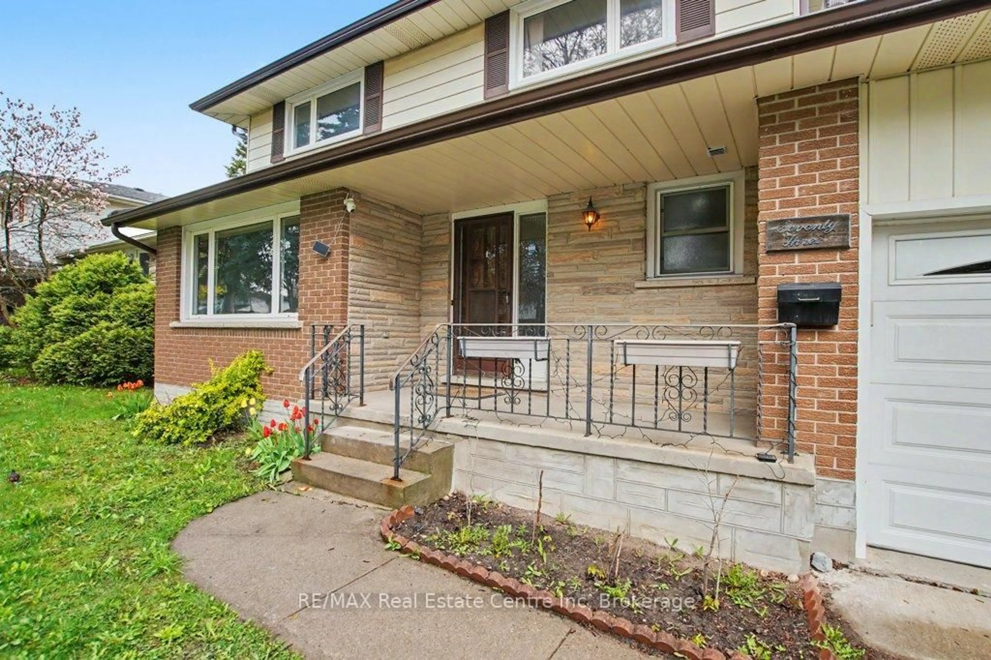 Home with brick exterior material, street for 73 Harvard Rd, Guelph Ontario N1G 2X9