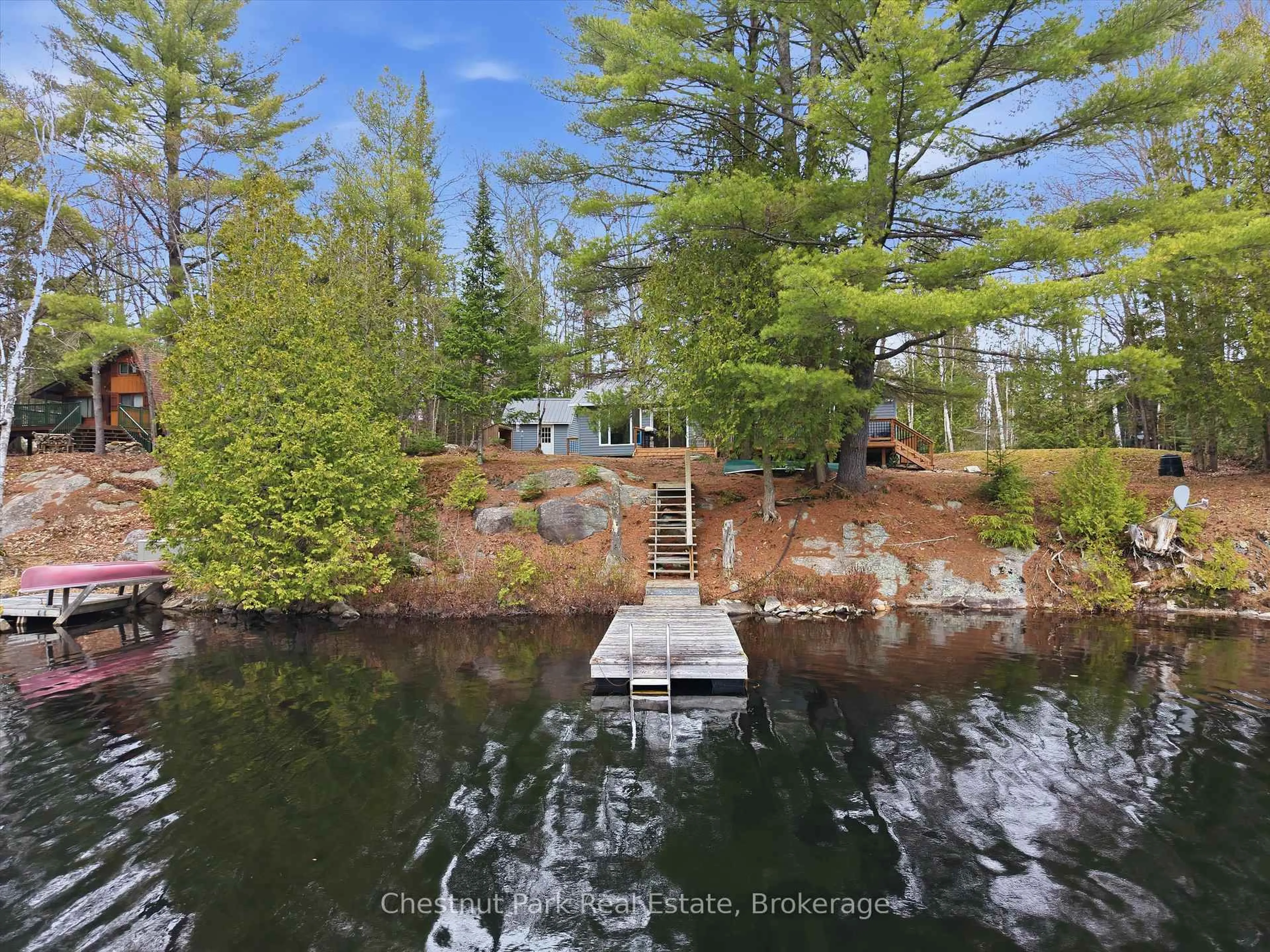 A pic from outside/outdoor area/front of a property/back of a property/a pic from drone, water/lake/river/ocean view for 1299 Dickie Lake Rd, Lake of Bays Ontario P0B 1A0