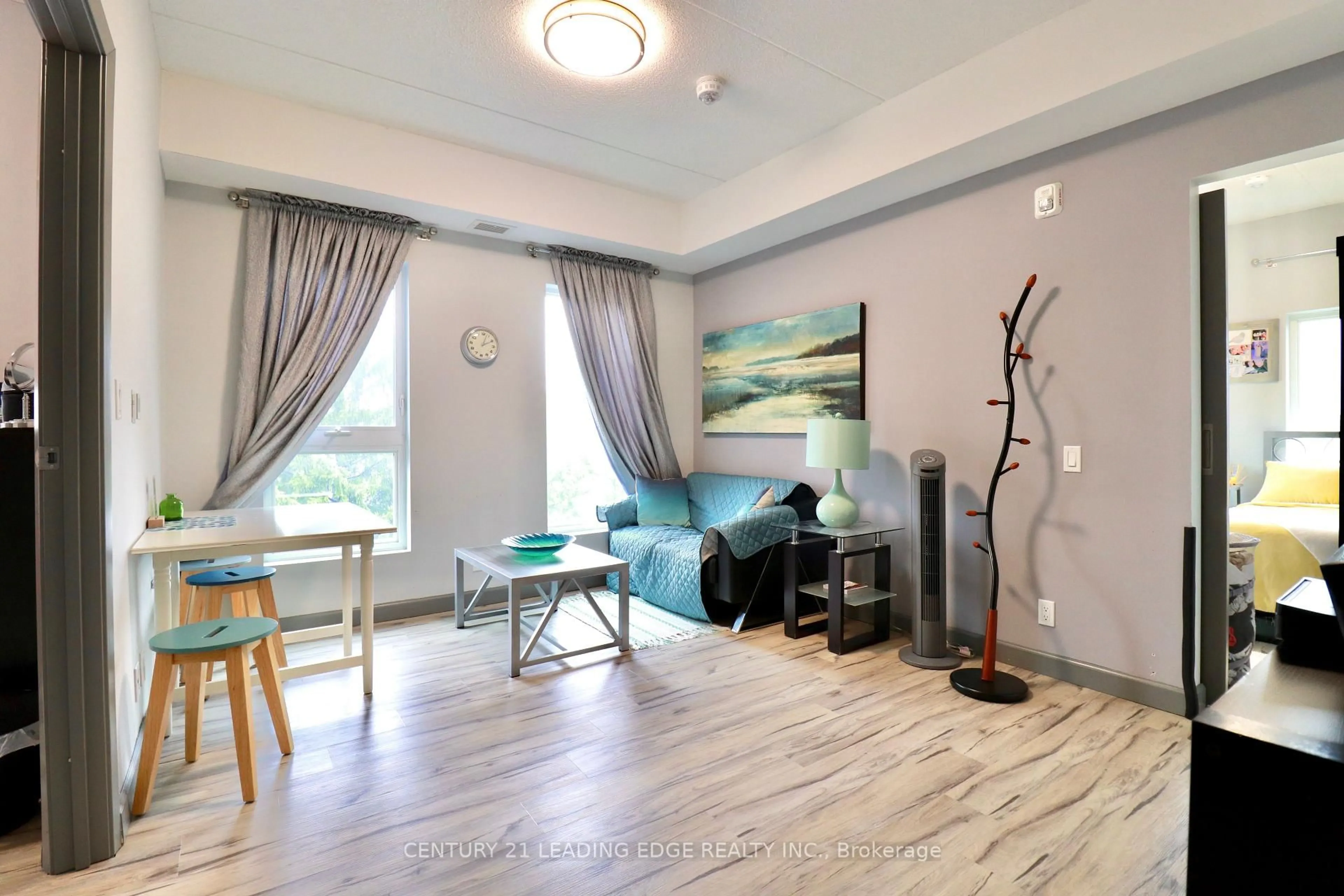 Living room with furniture, wood/laminate floor for 77 LELAND St #422, Hamilton Ontario L8S 3A1