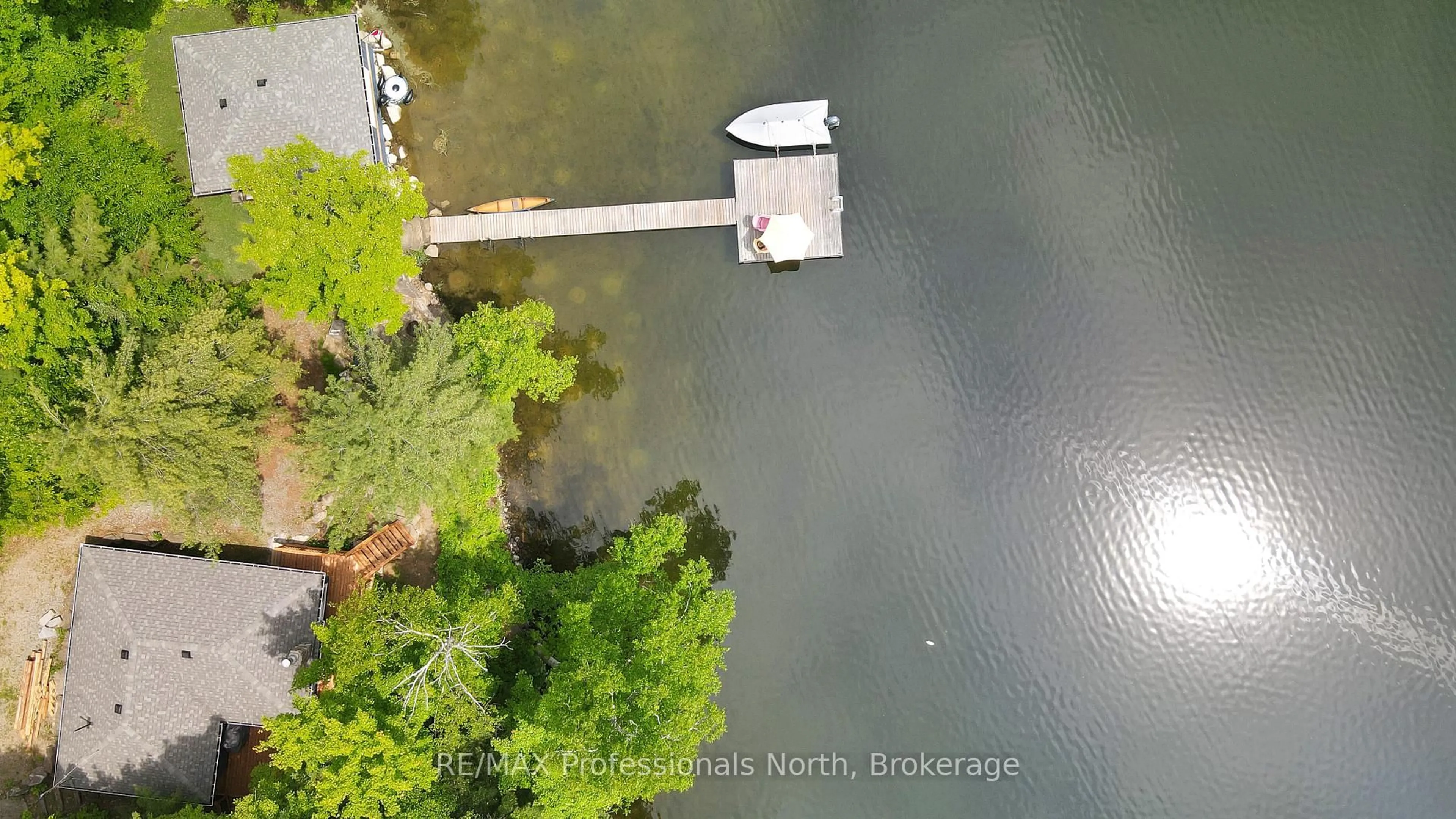 A pic from outside/outdoor area/front of a property/back of a property/a pic from drone, water/lake/river/ocean view for 1027 Rothwell Dr, Highlands East Ontario K0L 3C0