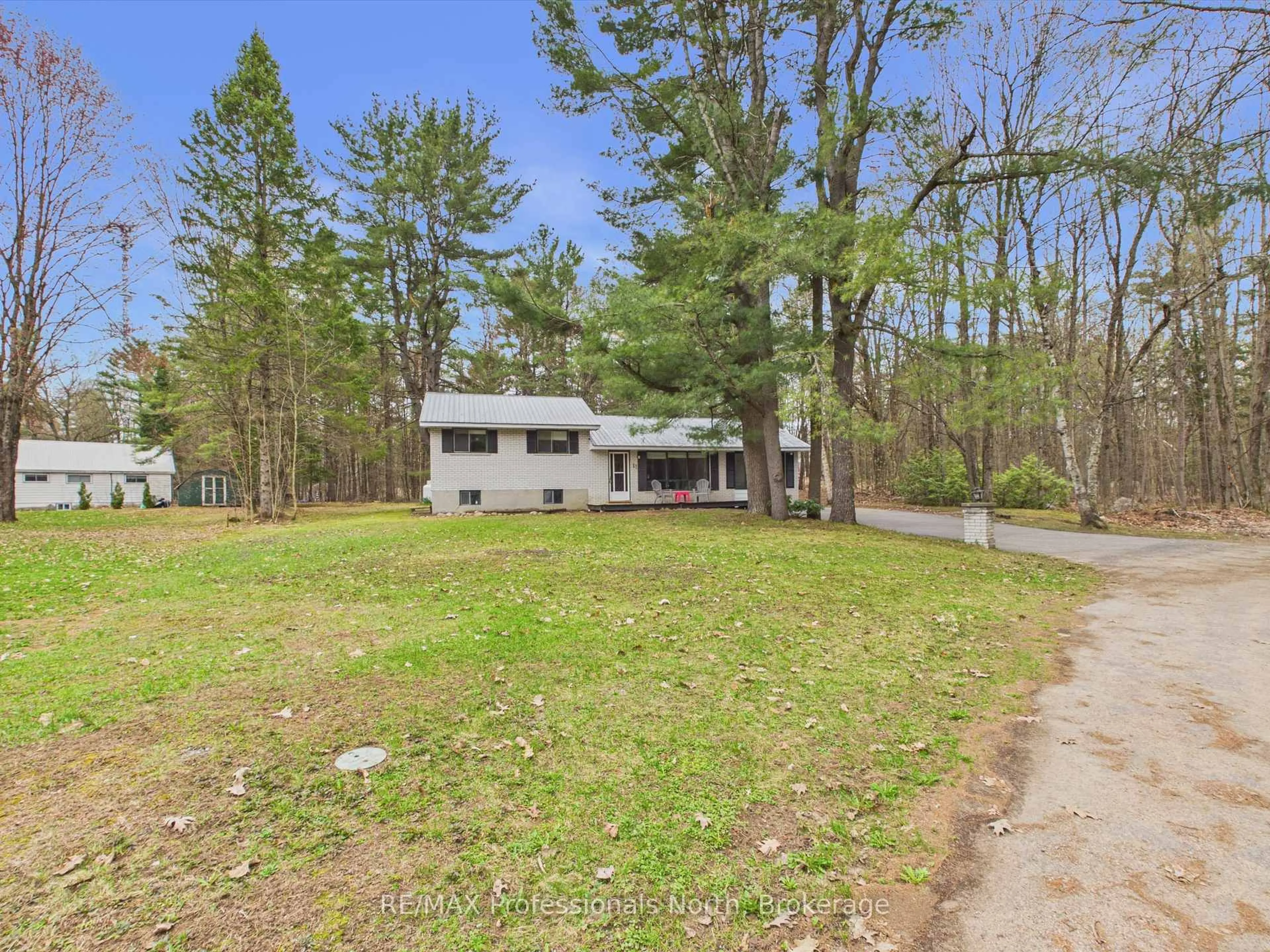 A pic from outside/outdoor area/front of a property/back of a property/a pic from drone, forest/trees view for 11 Beacon Lane, Bracebridge Ontario P1L 1L6