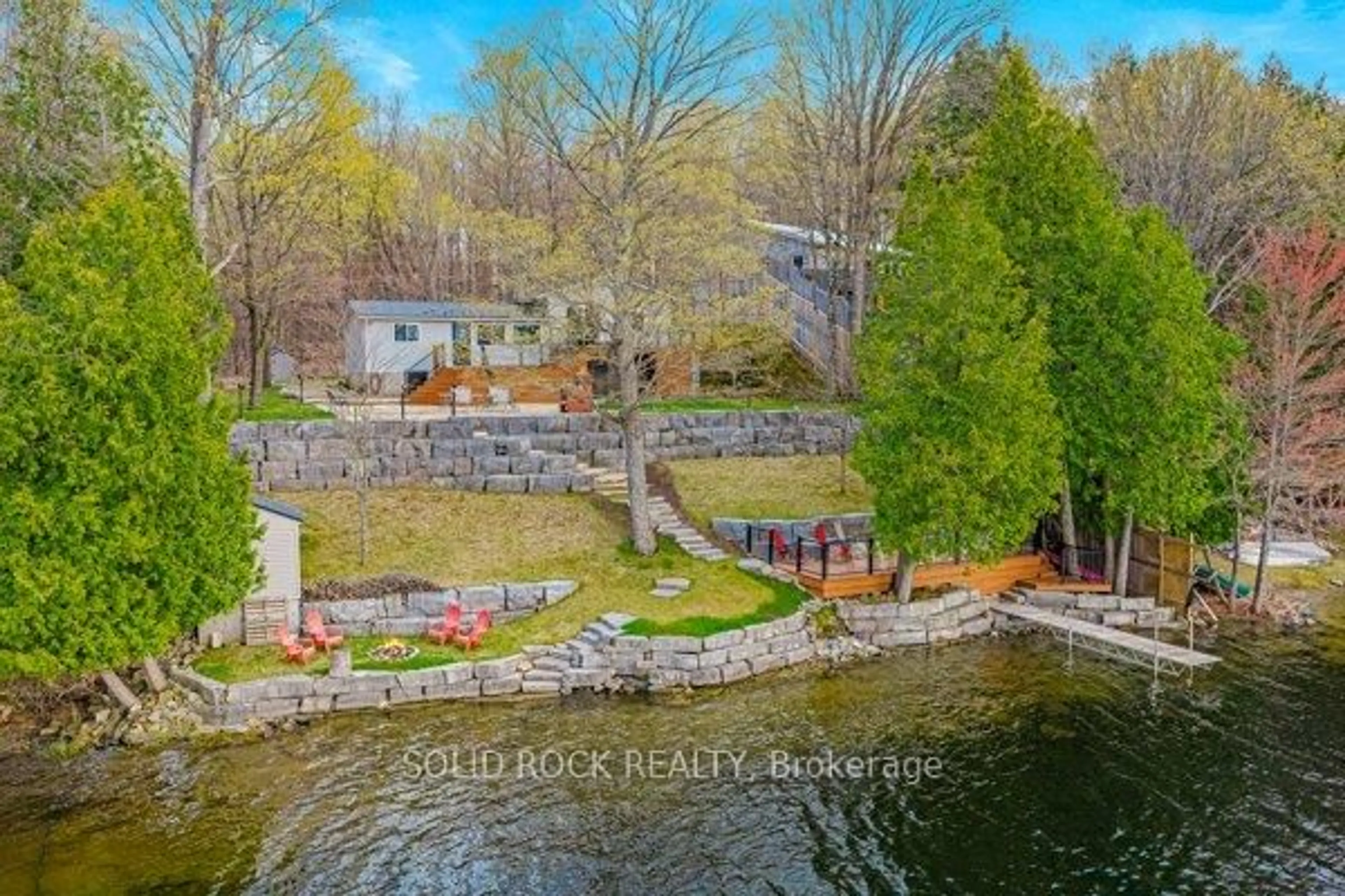A pic from outside/outdoor area/front of a property/back of a property/a pic from drone, water/lake/river/ocean view for 14 Lower Lake Lane, Godfrey Ontario K0H 1T0