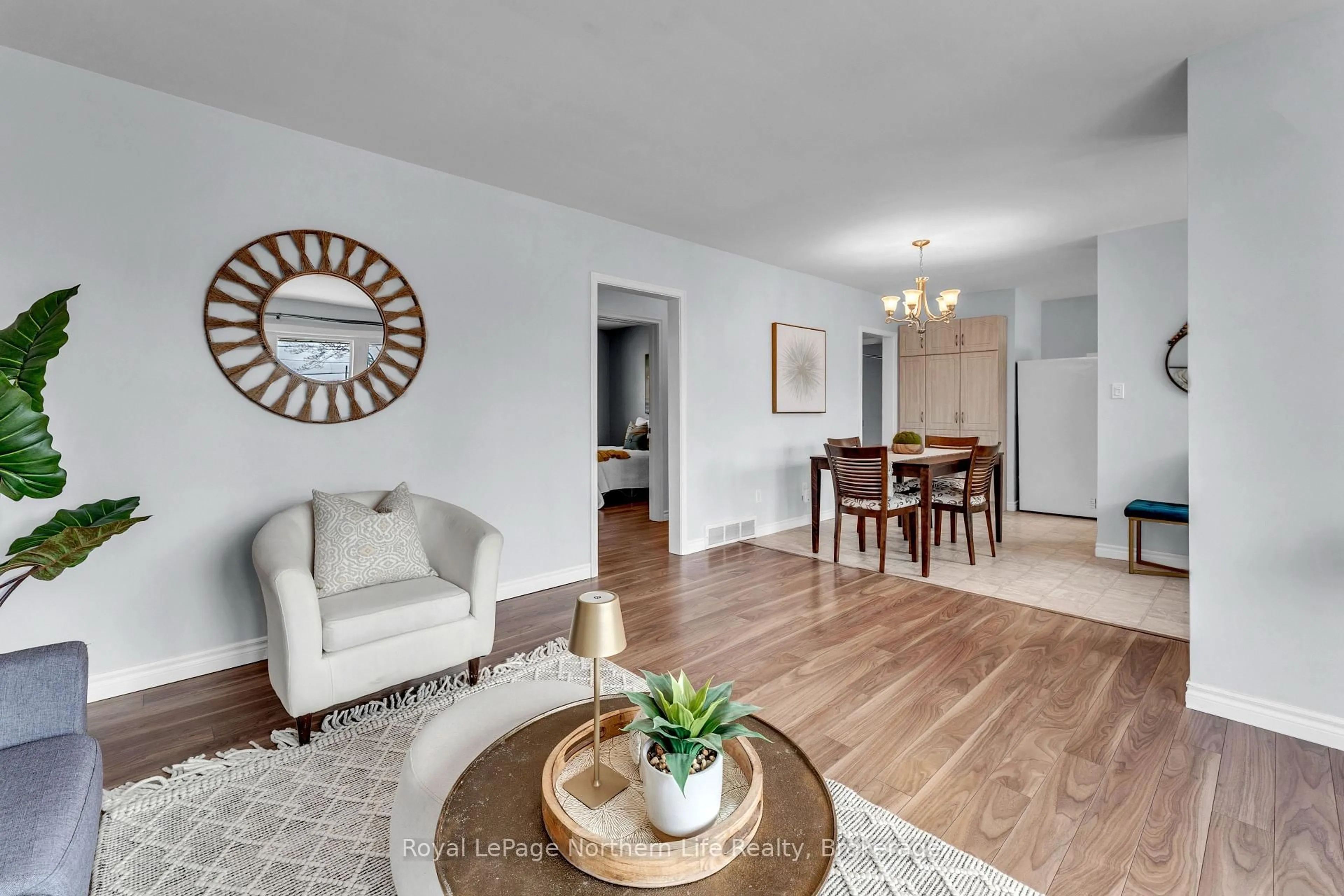 Living room with furniture, wood/laminate floor for 348 Norwood Ave, North Bay Ontario P1B 5E4
