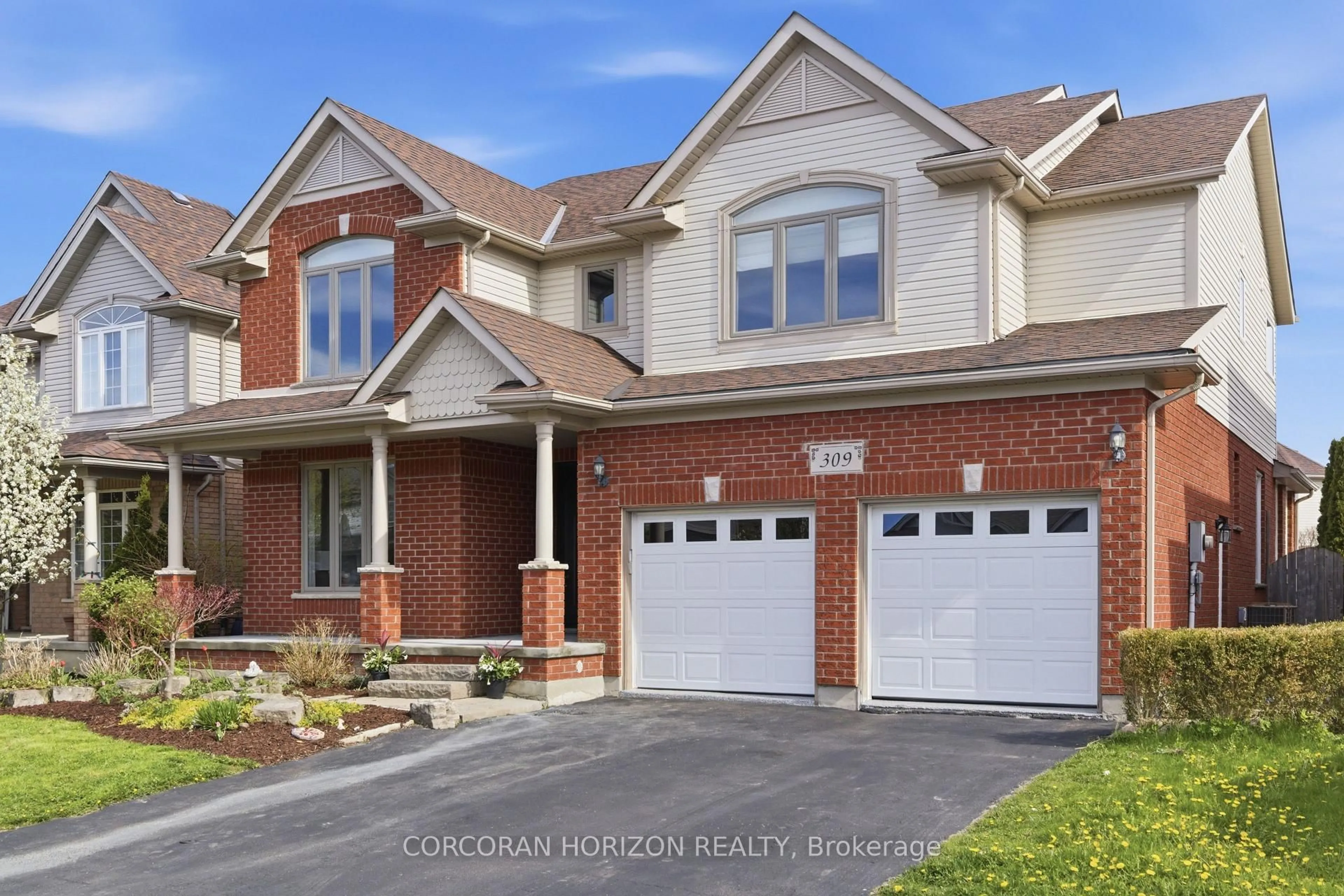 Home with brick exterior material, street for 309 Schooner Cres, Waterloo Ontario N2K 4M5