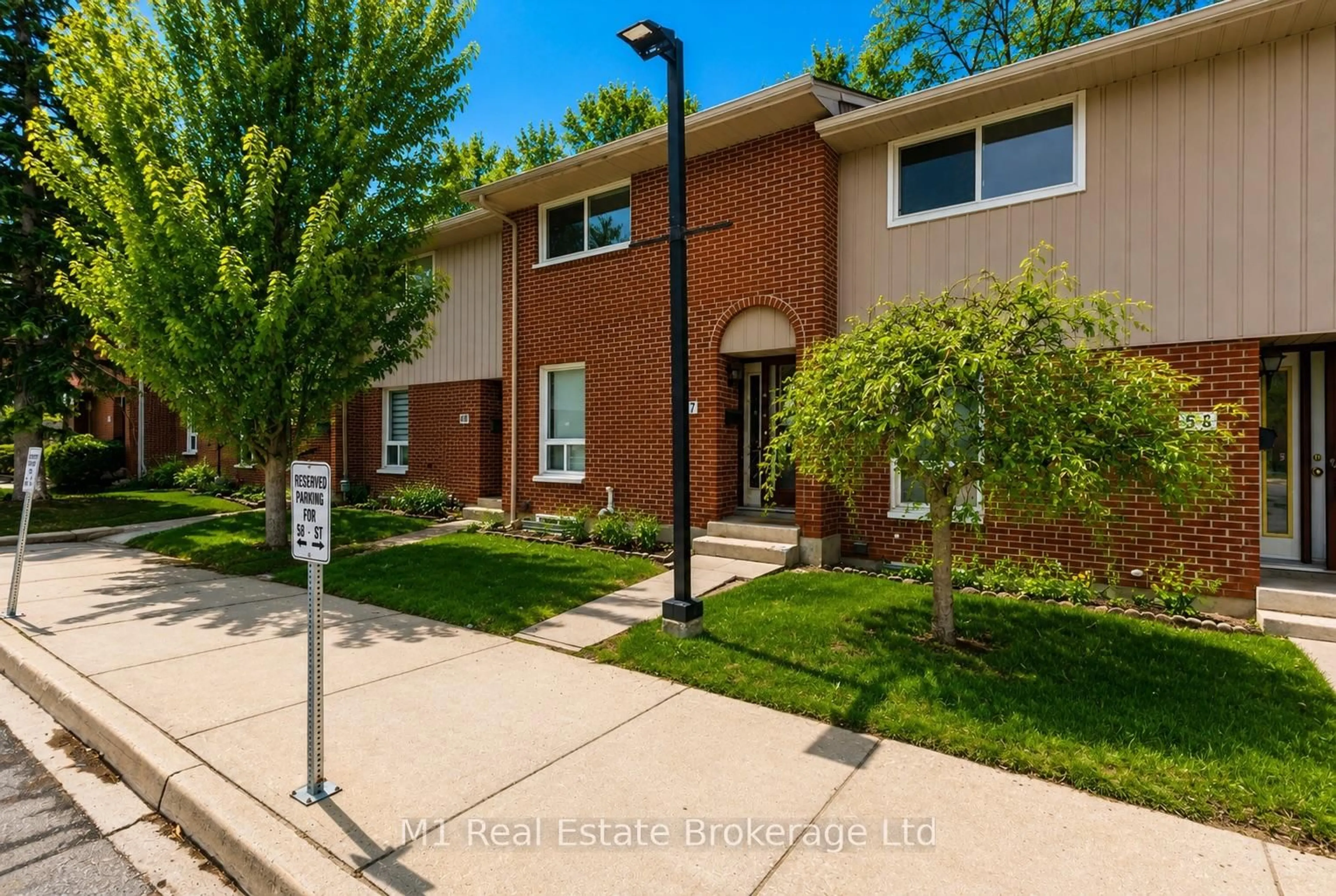 Home with brick exterior material, street for 49 Rhonda Rd #57, Guelph Ontario N1H 7A4