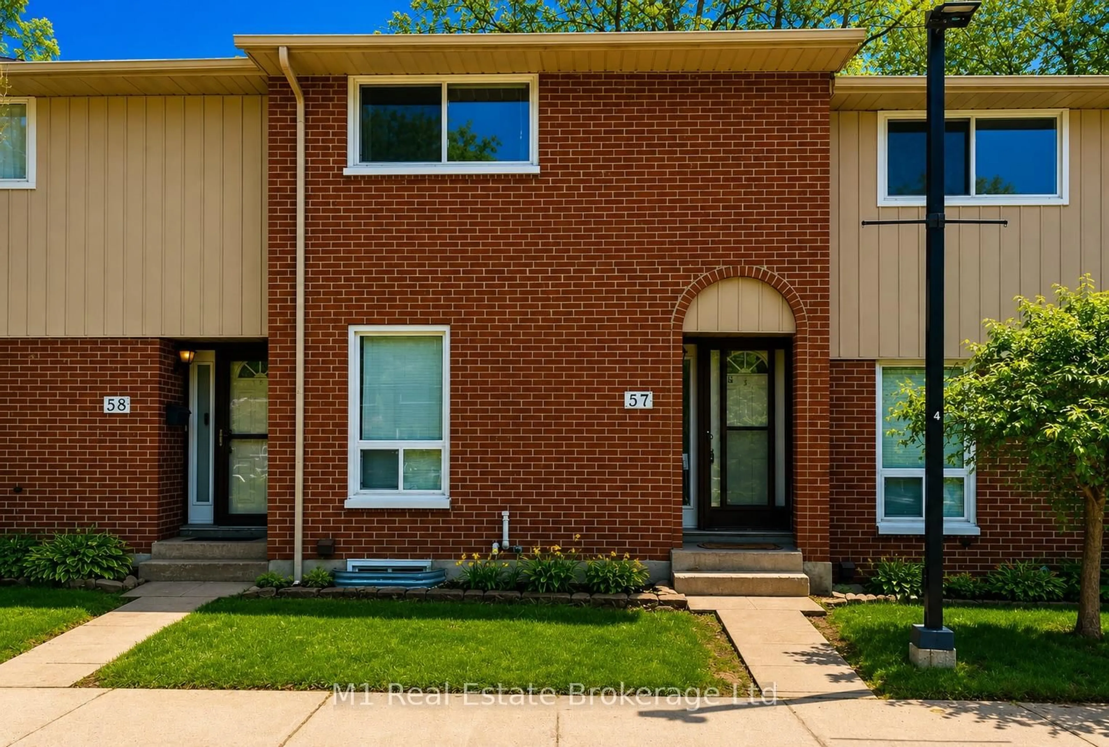 Home with brick exterior material, street for 49 Rhonda Rd #57, Guelph Ontario N1H 7A4