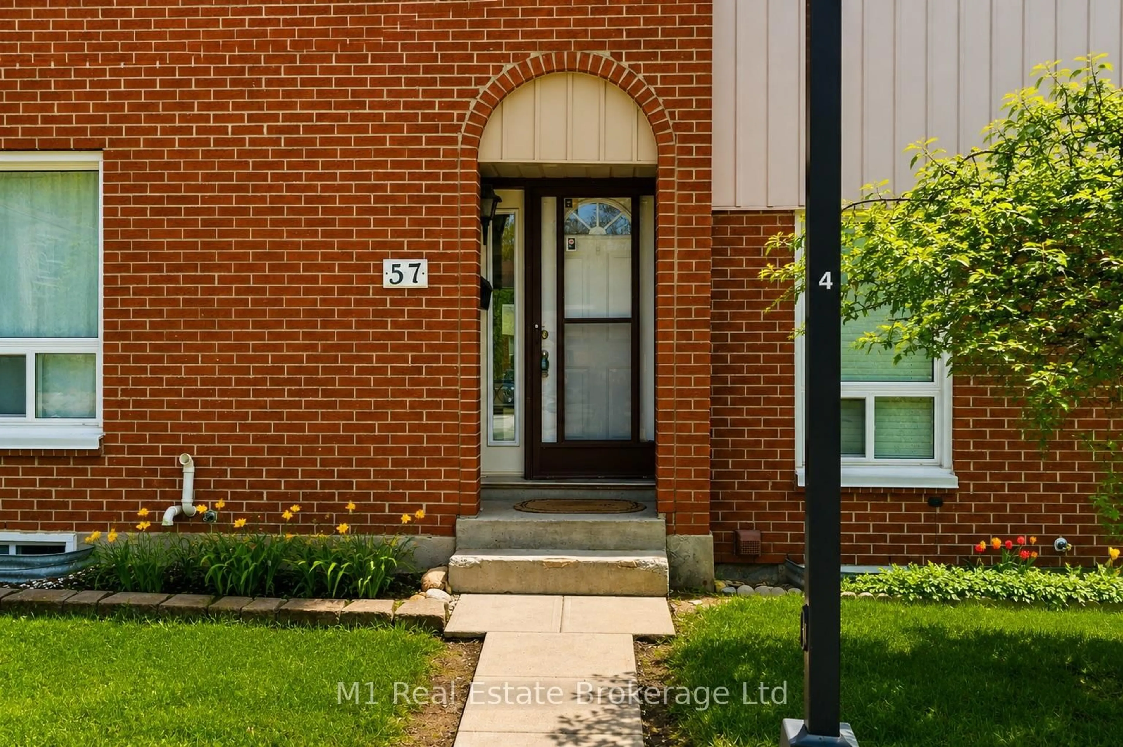 Home with brick exterior material, street for 49 Rhonda Rd #57, Guelph Ontario N1H 7A4