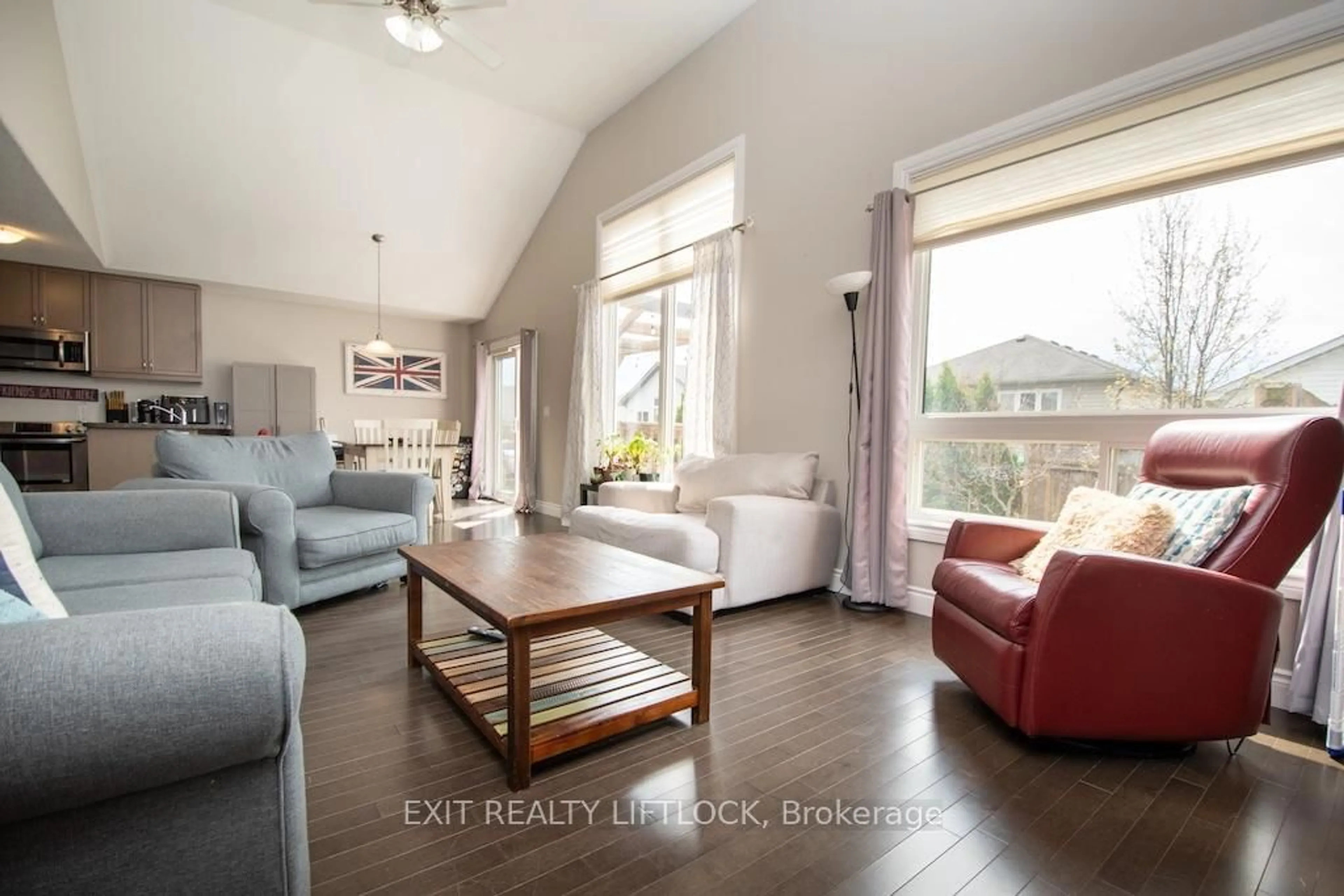 Living room with furniture, wood/laminate floor for 2679 Foxmeadow Rd, Peterborough Ontario K9L 0A8