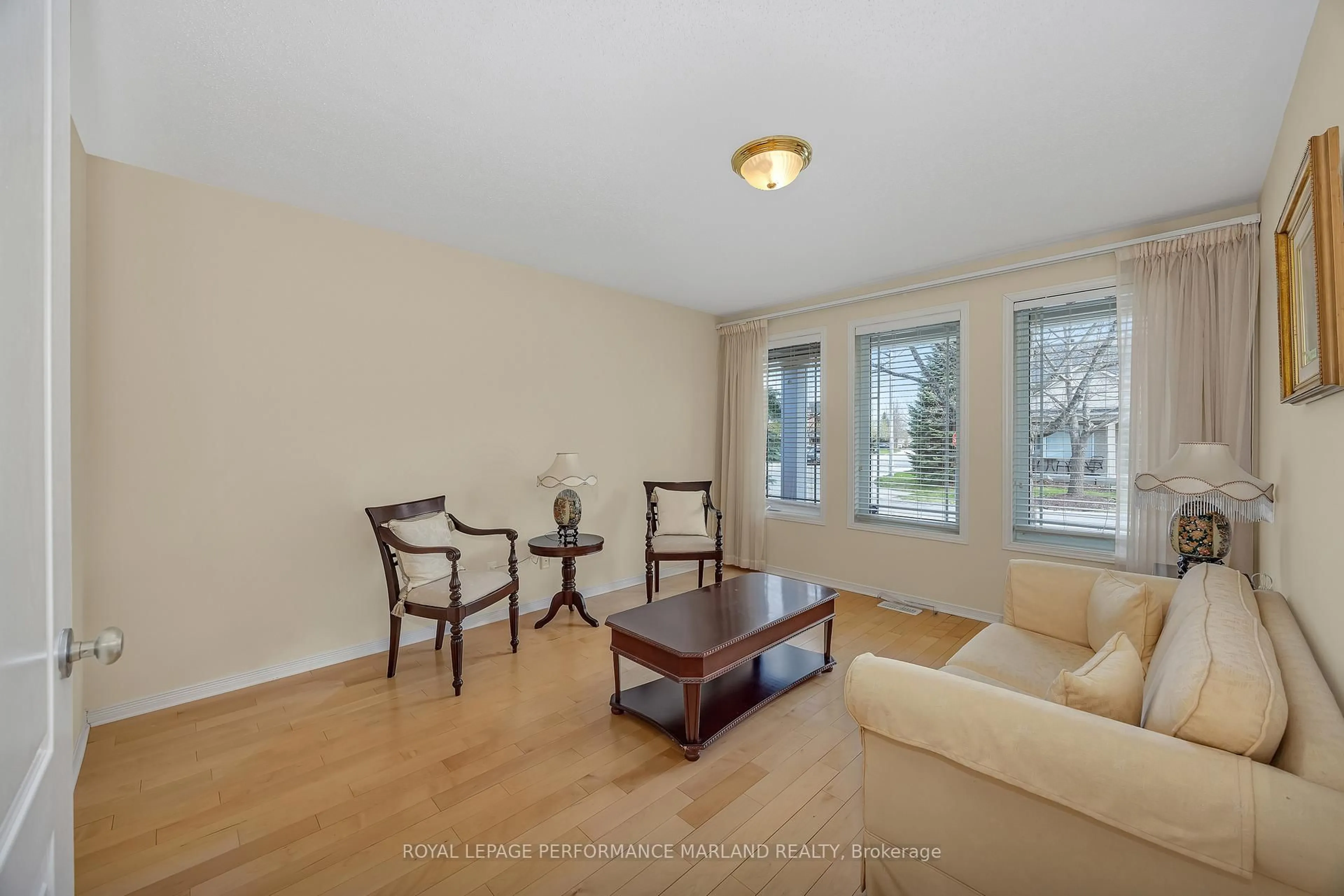 Living room with furniture, wood/laminate floor for 30 Yorkwood Pl, Ottawa Ontario K2G 6Z6