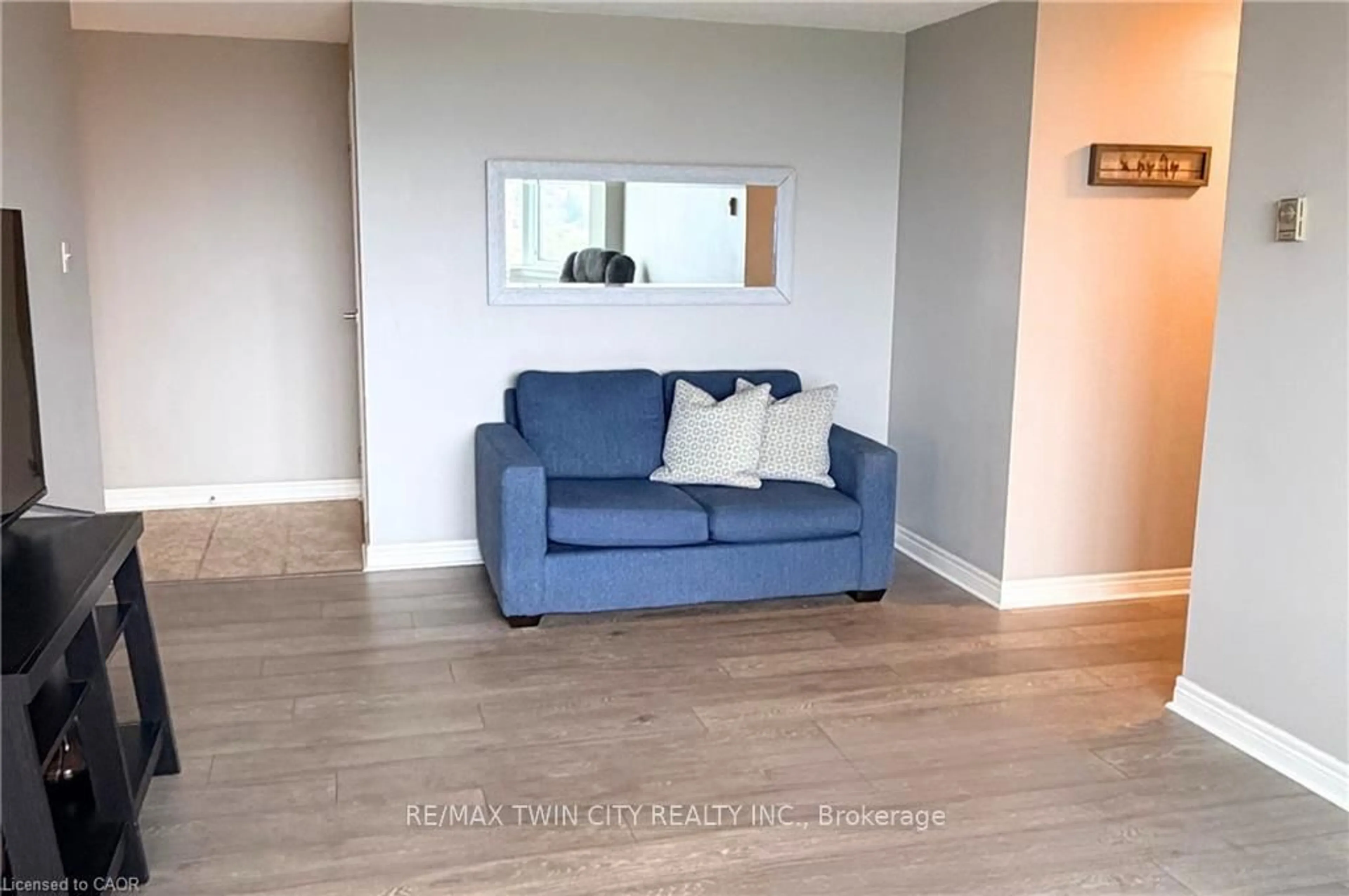 Living room with furniture, wood/laminate floor for 35 Green Valley Dr #1605, Kitchener Ontario N2P 2A5