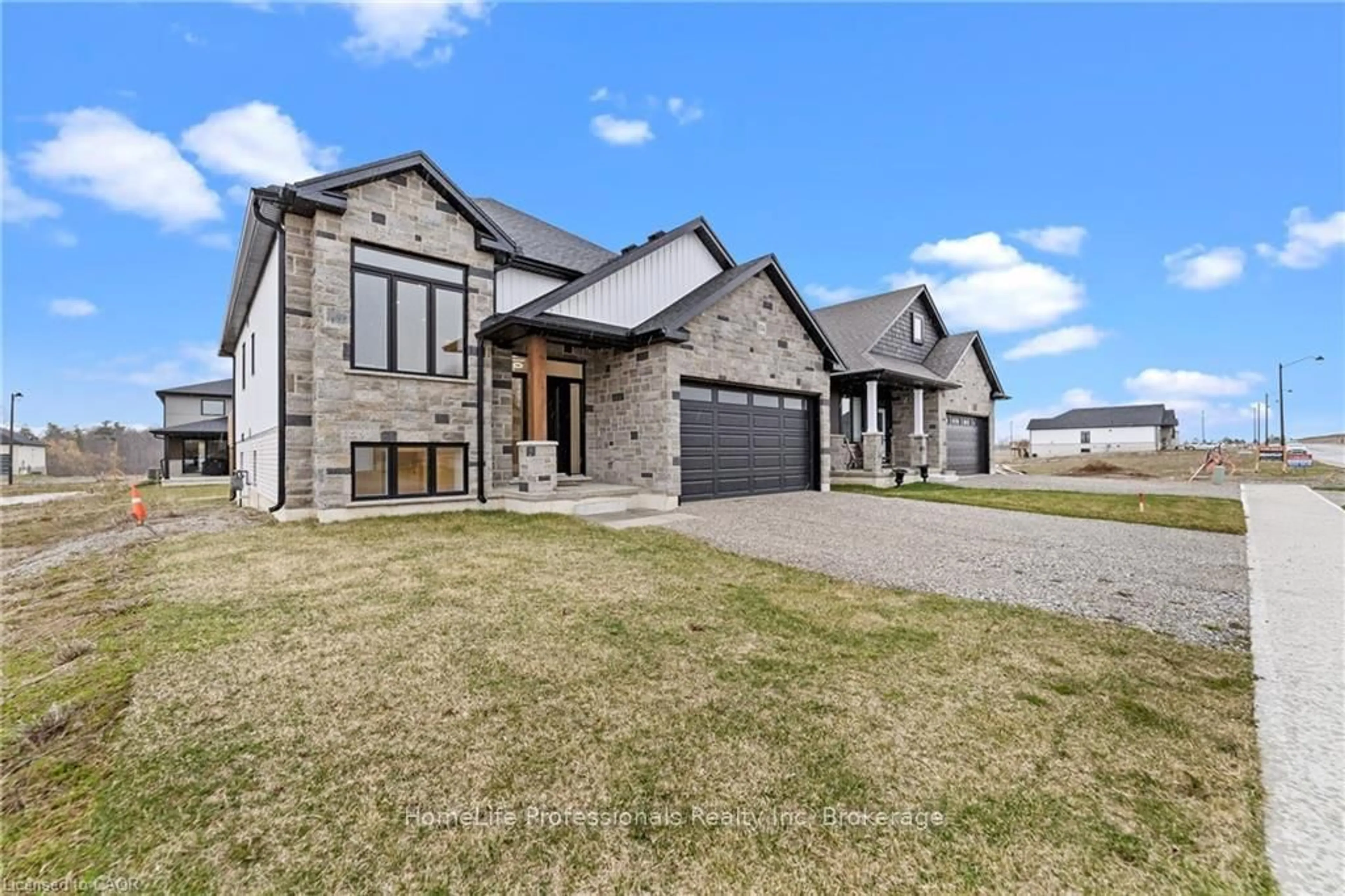 Home with brick exterior material, street for 174 PIKE CREEK Dr, Haldimand Ontario N0A 1E0