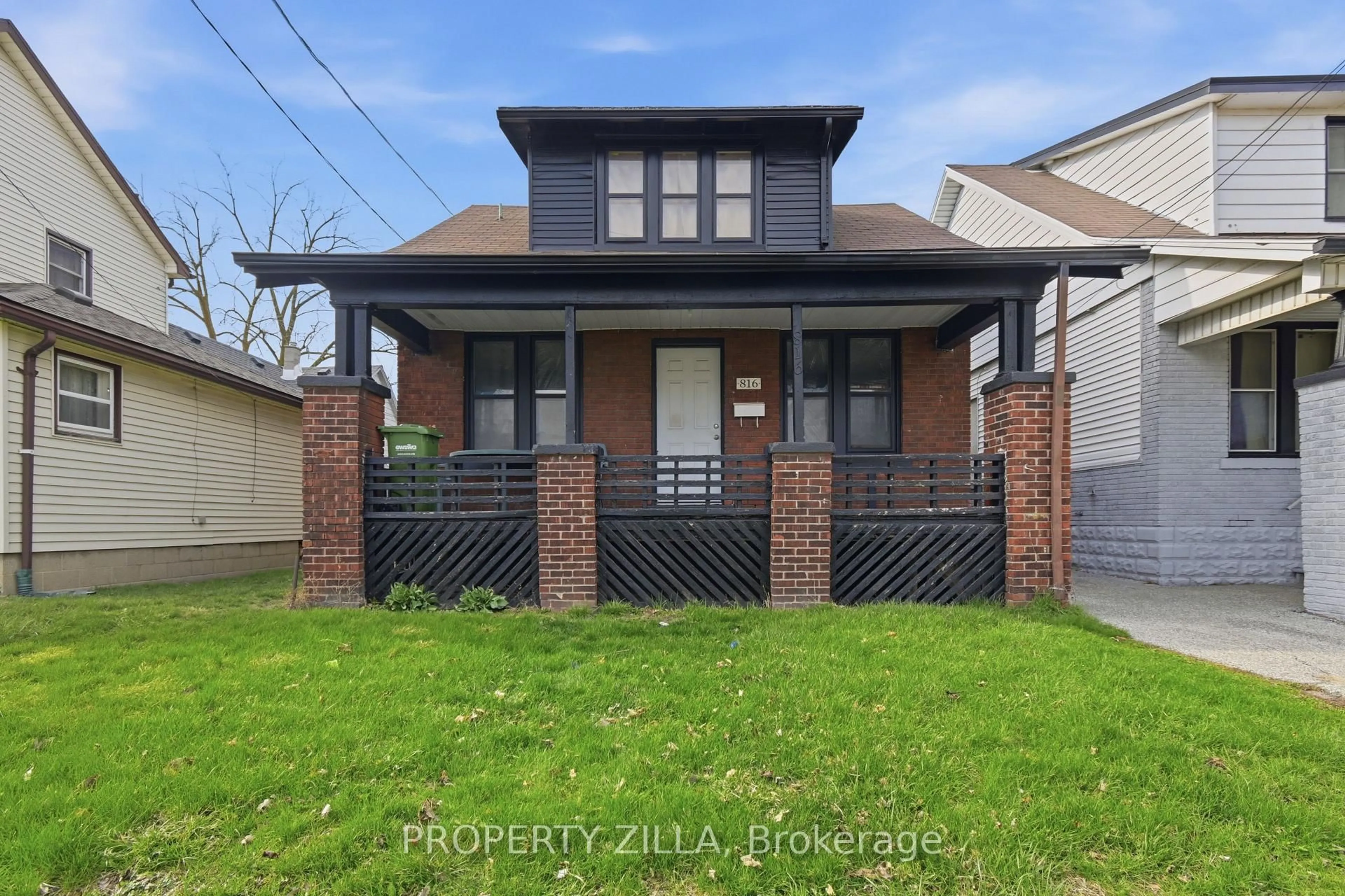 Home with brick exterior material, street for 819-829 RIVERSIDE Dr, Windsor Ontario N9A 2T4