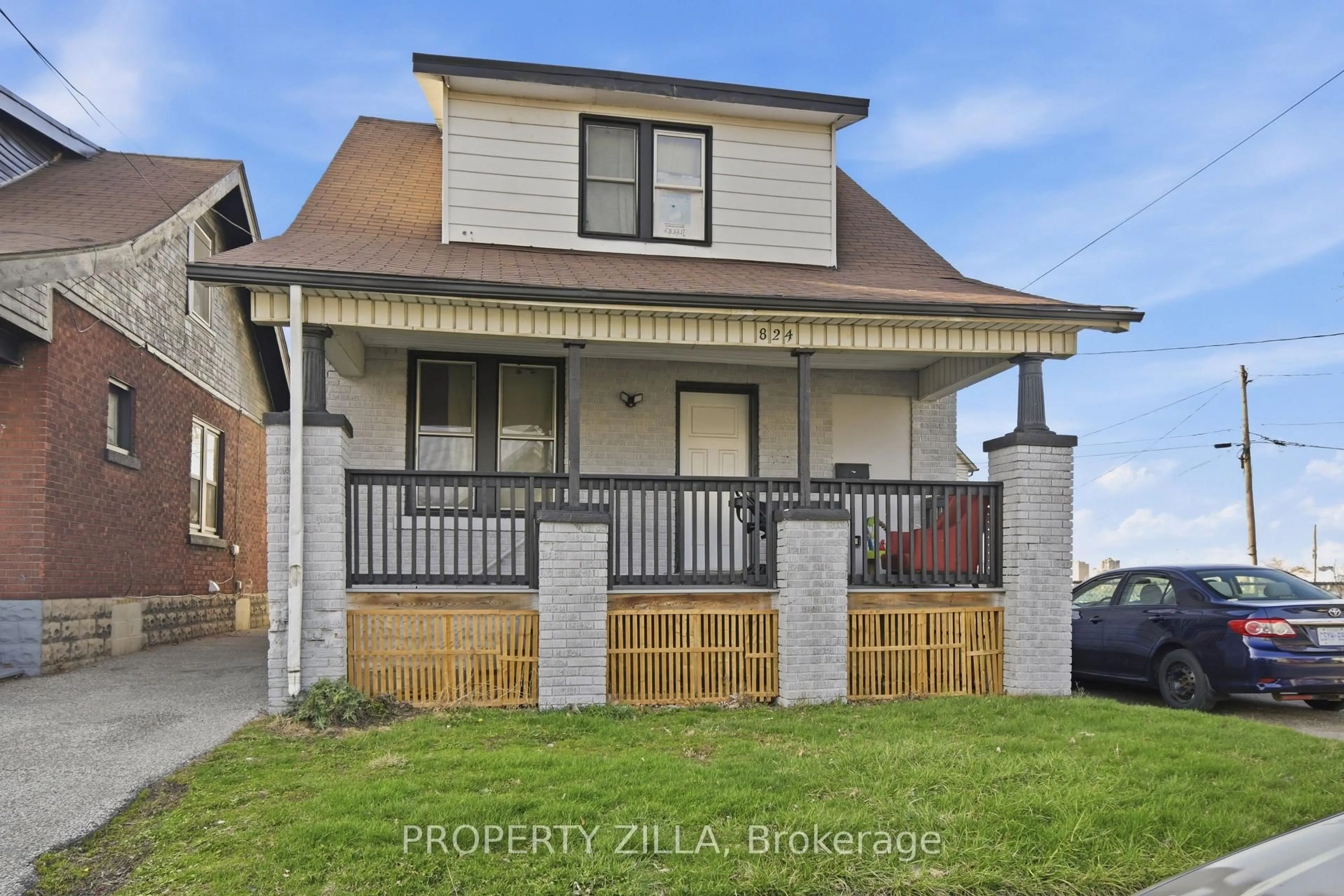 Home with brick exterior material, street for 819-829 RIVERSIDE Dr, Windsor Ontario N9A 2T4