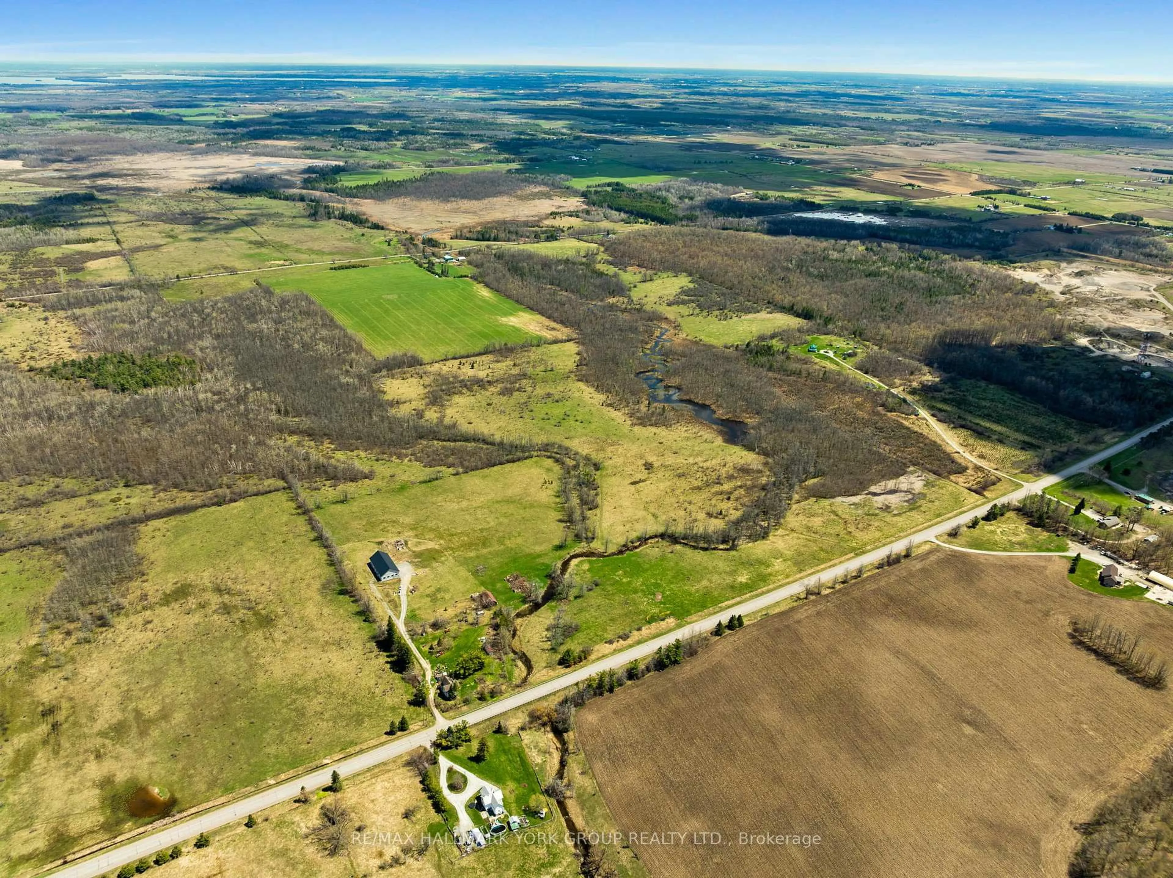 A pic from outside/outdoor area/front of a property/back of a property/a pic from drone, water/lake/river/ocean view for 2468 County Road 46, Kawartha Lakes Ontario K0M 2T0