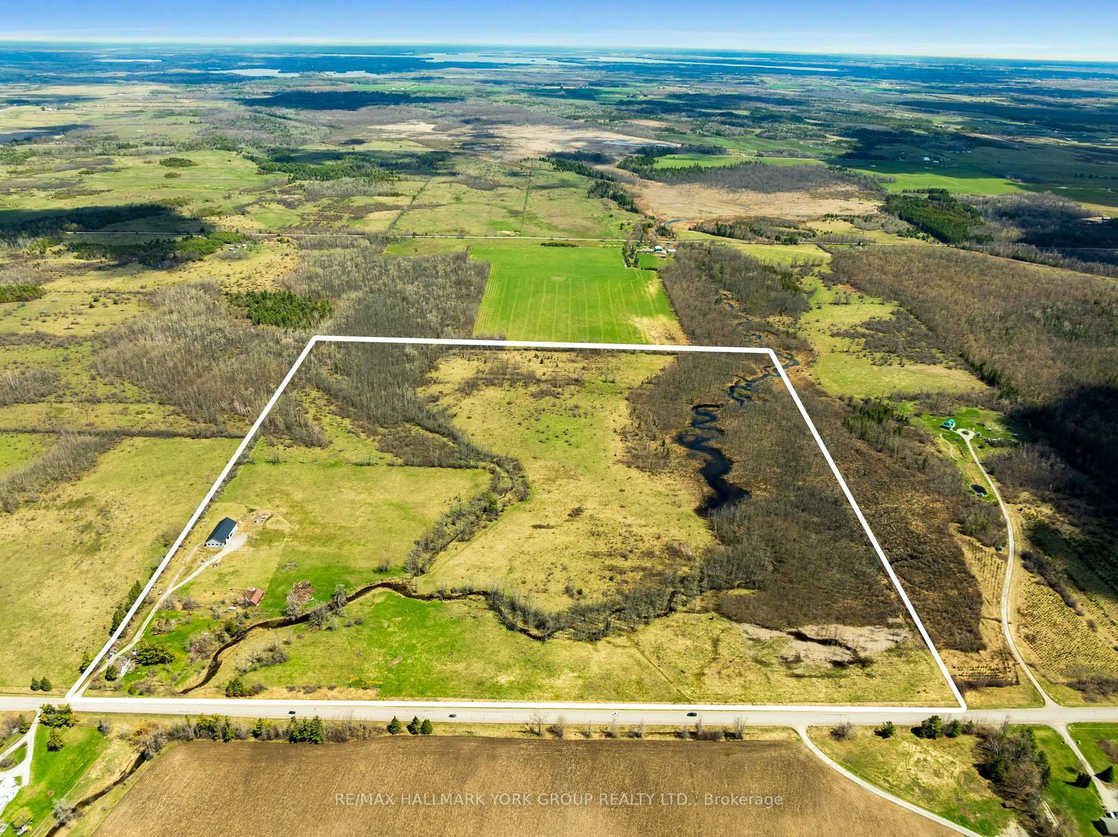 A pic from outside/outdoor area/front of a property/back of a property/a pic from drone, water/lake/river/ocean view for 2468 County Road 46, Kawartha Lakes Ontario K0M 2T0