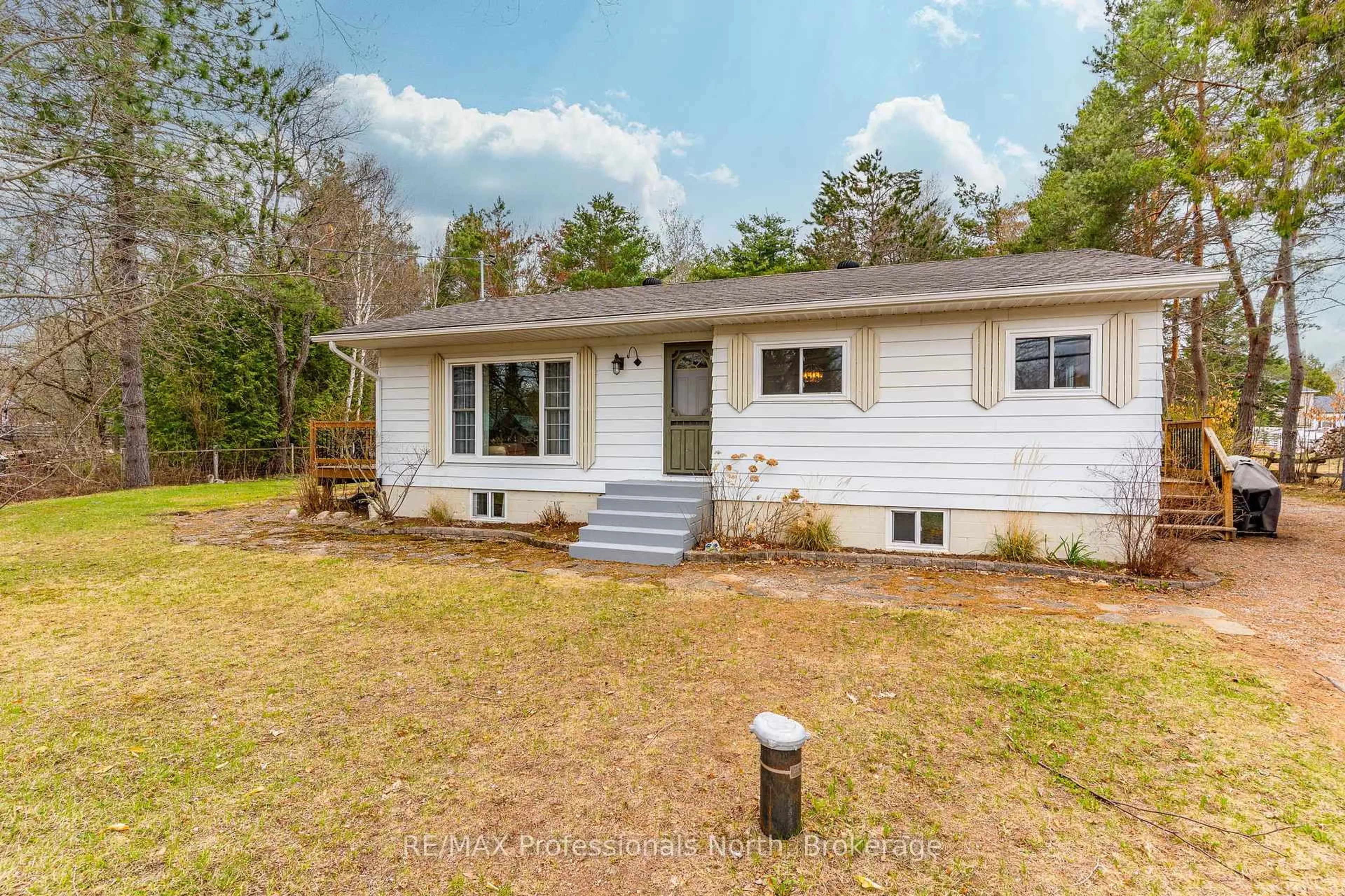 Home with vinyl exterior material, street for 2195 Loop Rd, Highlands East Ontario K0L 3C0