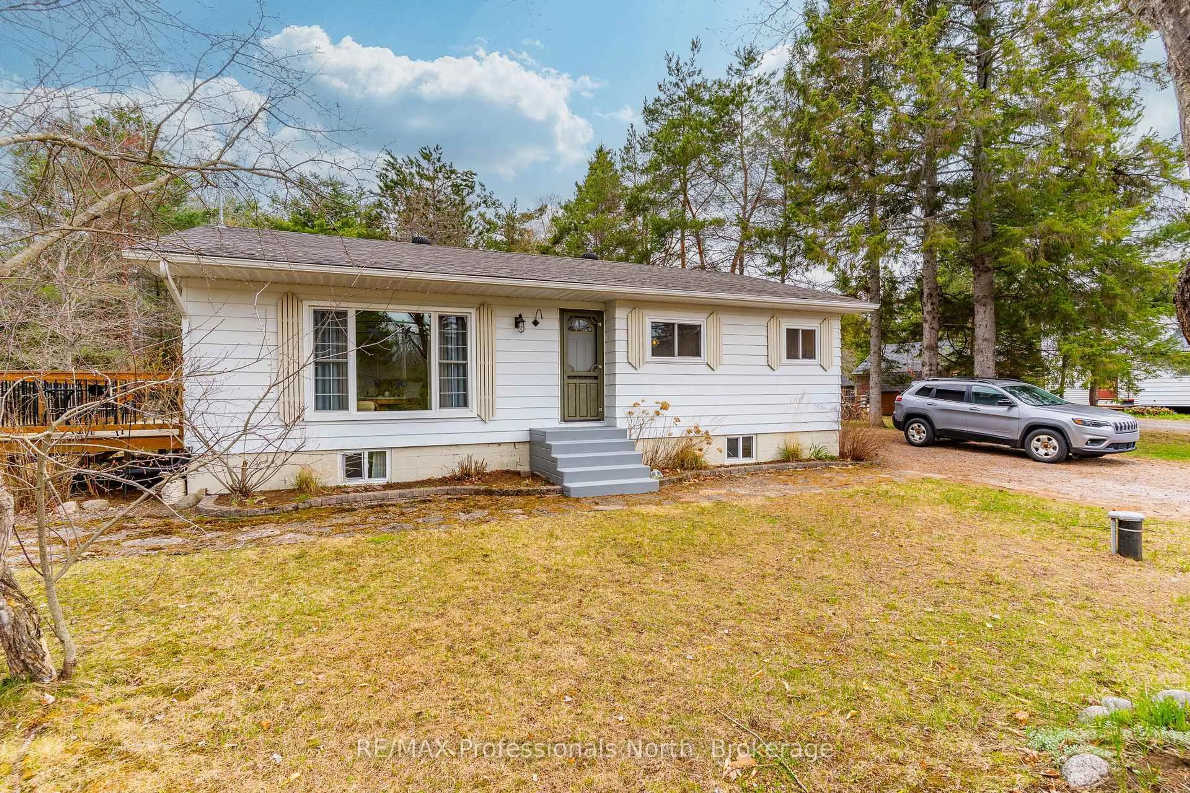 Home with vinyl exterior material, street for 2195 Loop Rd, Highlands East Ontario K0L 3C0