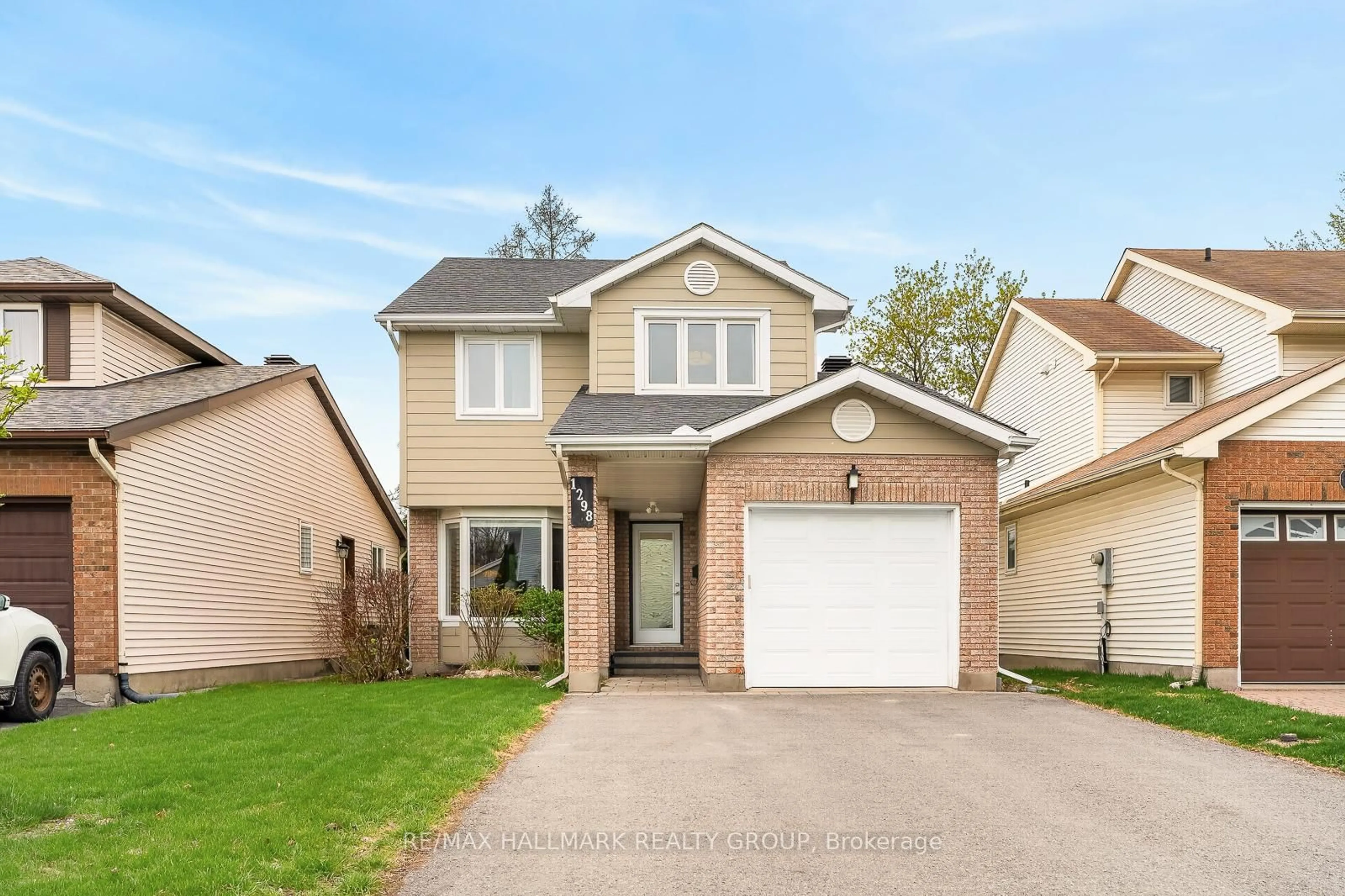 Home with vinyl exterior material, street for 1298 Famlit Crt, Ottawa Ontario K1J 9A1