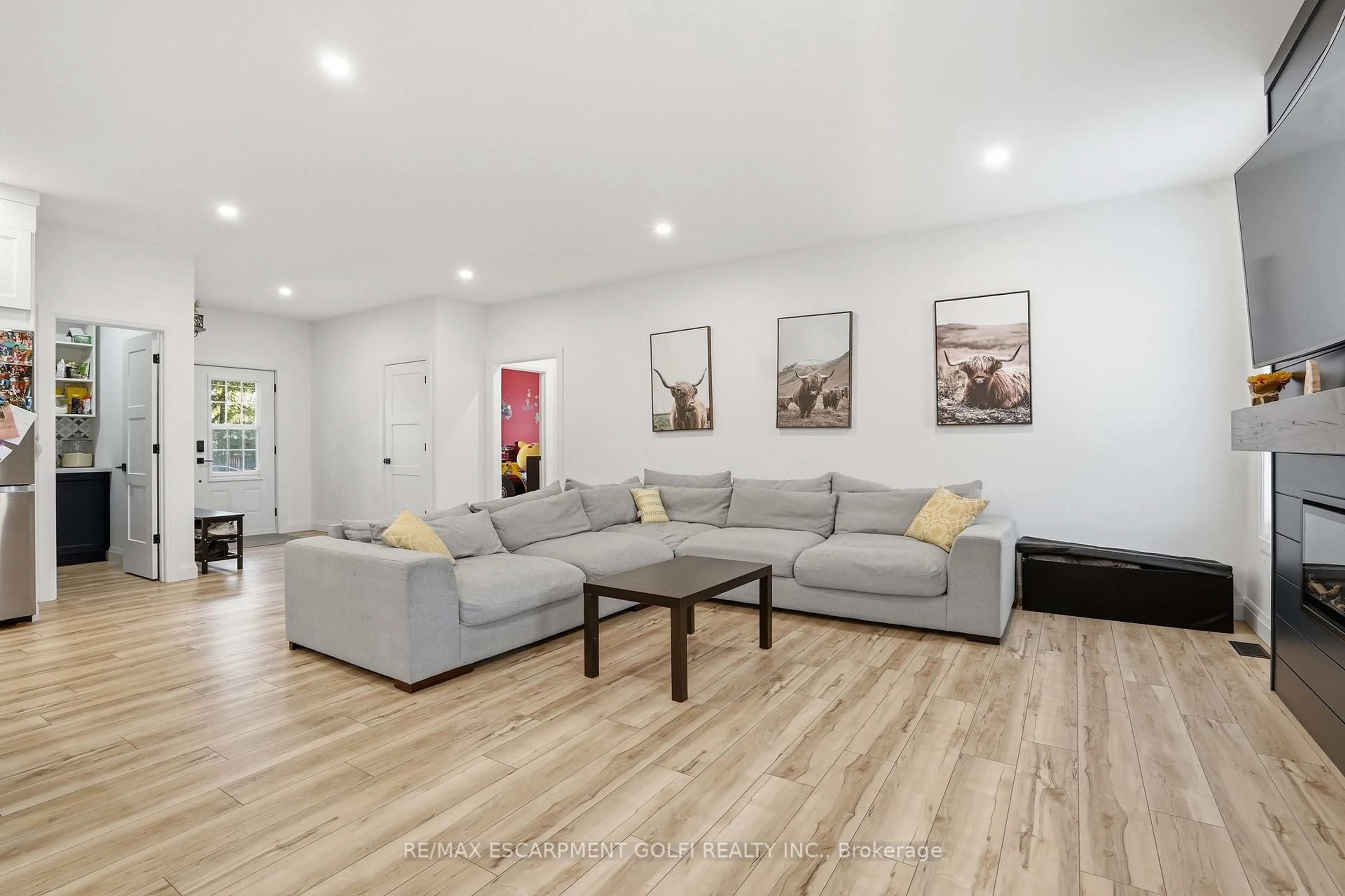 Living room with furniture, wood/laminate floor for 104 Neva Rd, Fort Erie Ontario L0S 1N0
