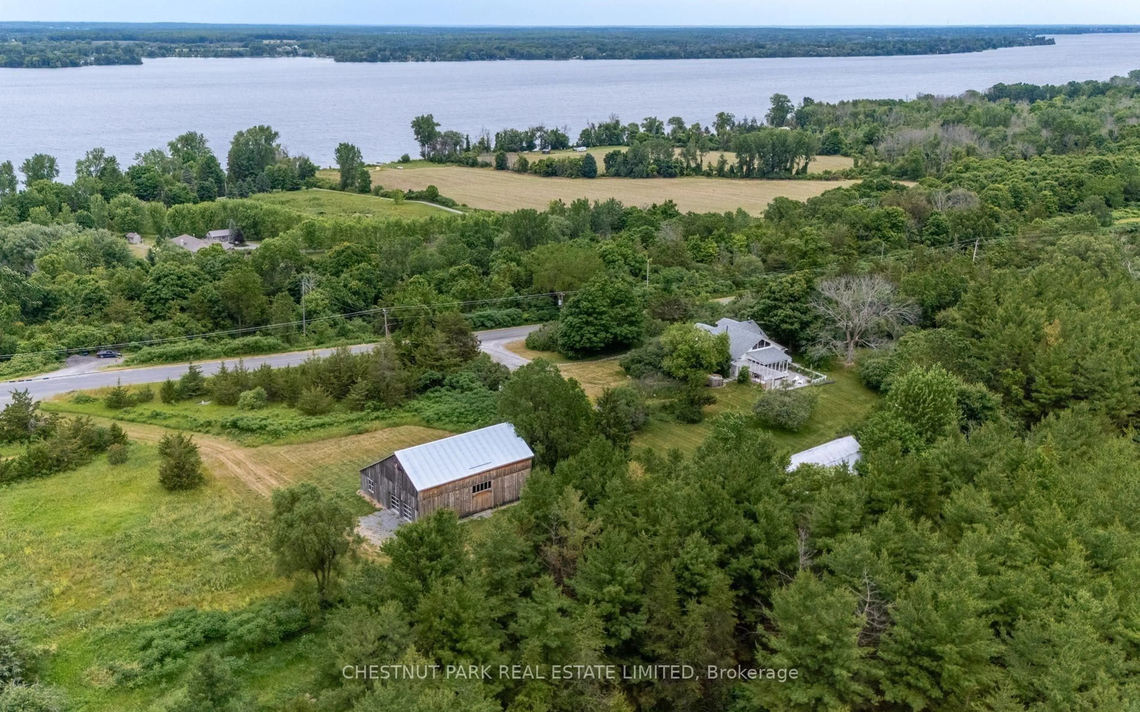 A pic from outside/outdoor area/front of a property/back of a property/a pic from drone, water/lake/river/ocean view for 1472 County Rd 7 Rd, Prince Edward County Ontario K0K 2T0