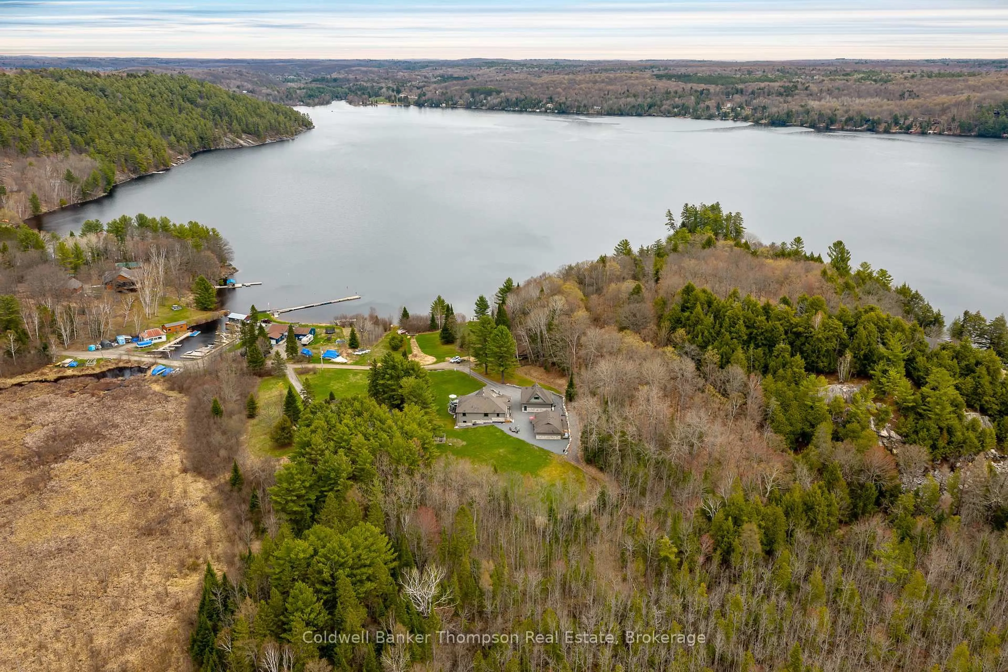 A pic from outside/outdoor area/front of a property/back of a property/a pic from drone, water/lake/river/ocean view for 112 Fitzgerald Dr, Huntsville Ontario P0B 1M0
