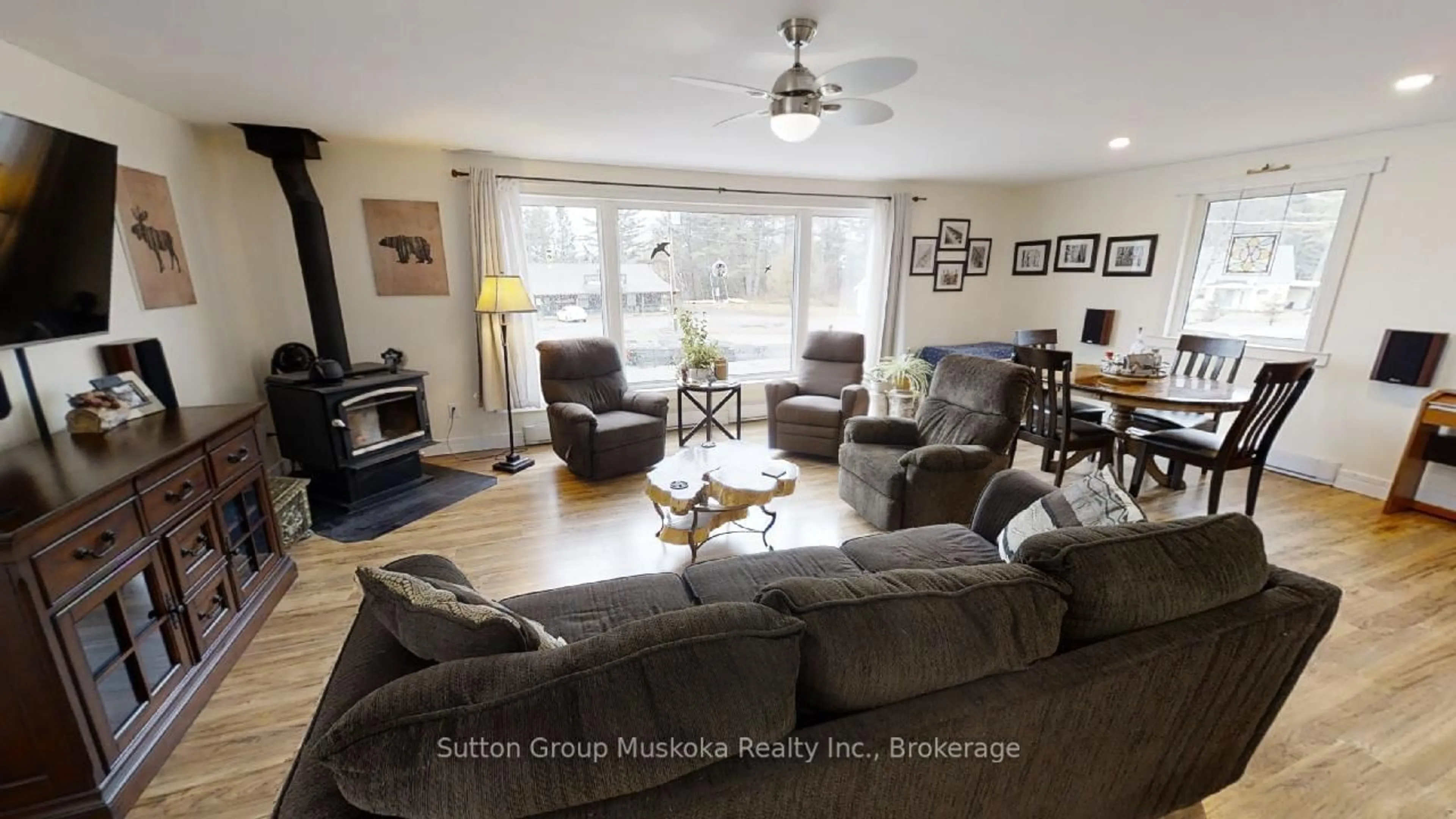 Living room with furniture, wood/laminate floor for 2831 60 Highway, Lake of Bays Ontario P0A 1H0