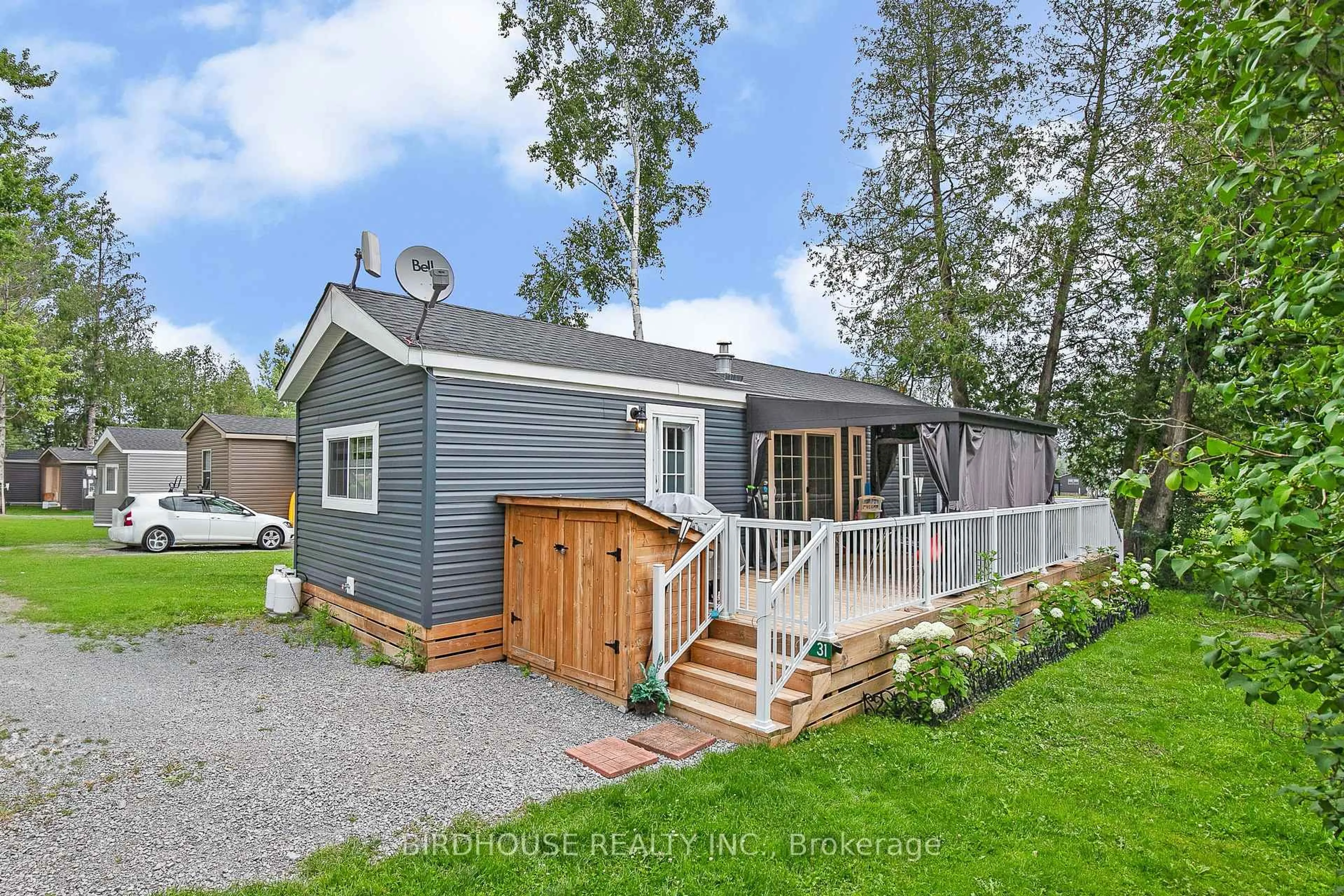 Home with vinyl exterior material, street for 657 Thunderbridge Rd #31, Kawartha Lakes Ontario K9V 4R1