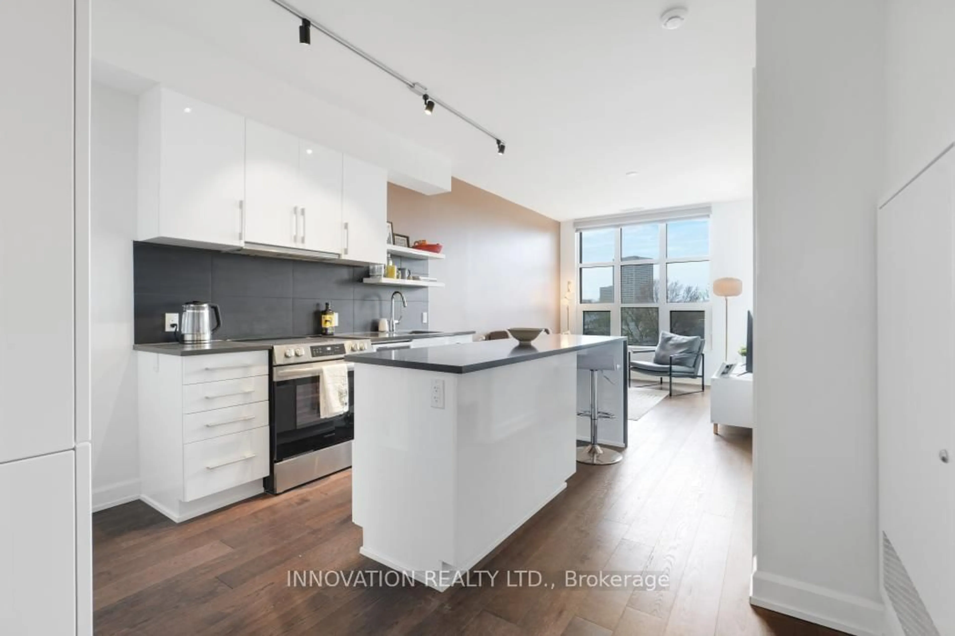Open concept kitchen, wood/laminate floor for 10 Rosemount Ave #410, Ottawa Ontario K1Y 1P4