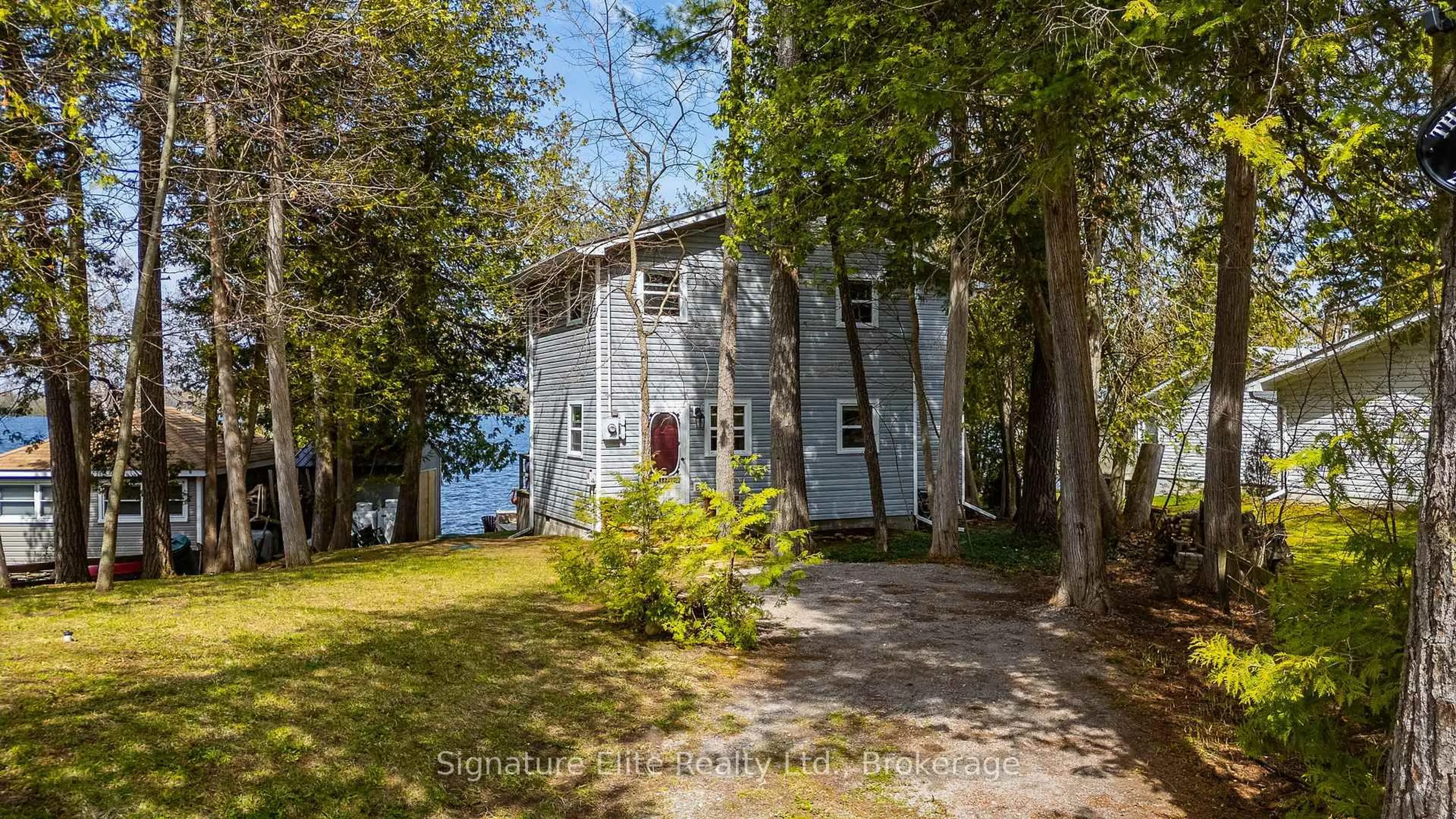 A pic from outside/outdoor area/front of a property/back of a property/a pic from drone, water/lake/river/ocean view for 24 Lambs Lane, Kawartha Lakes Ontario K0M 1G0