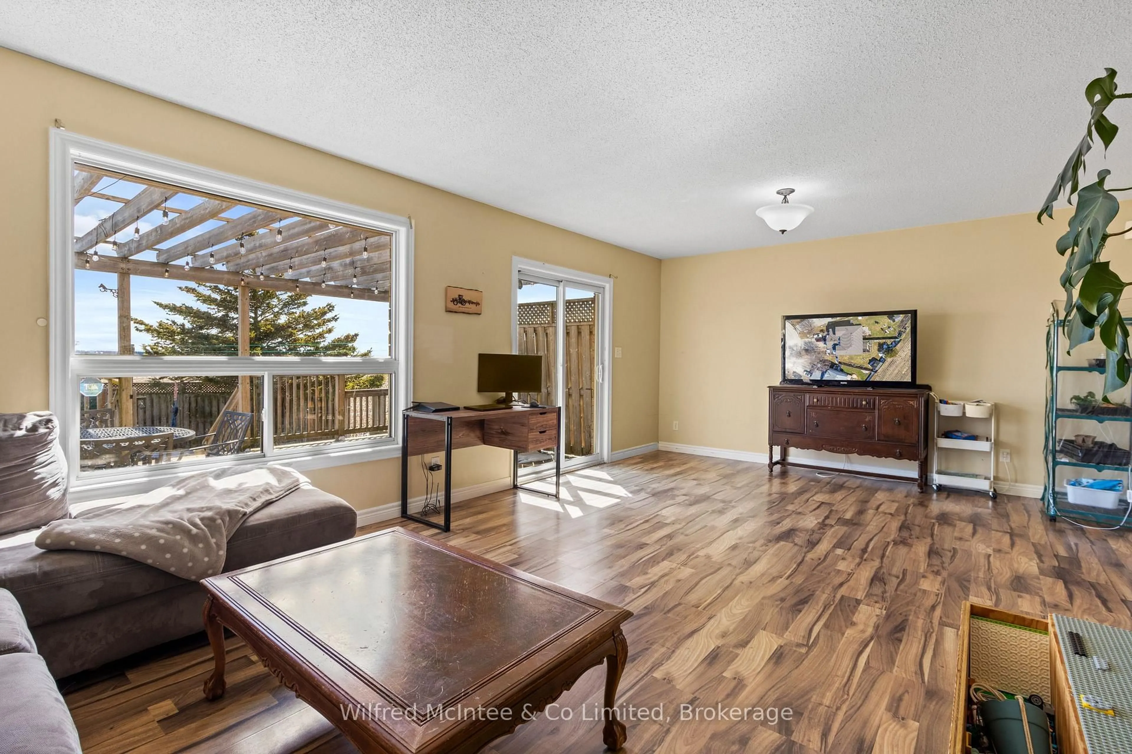 Living room with furniture, wood/laminate floor for 59 Dales Dr, Mapleton Ontario N0G 1P0