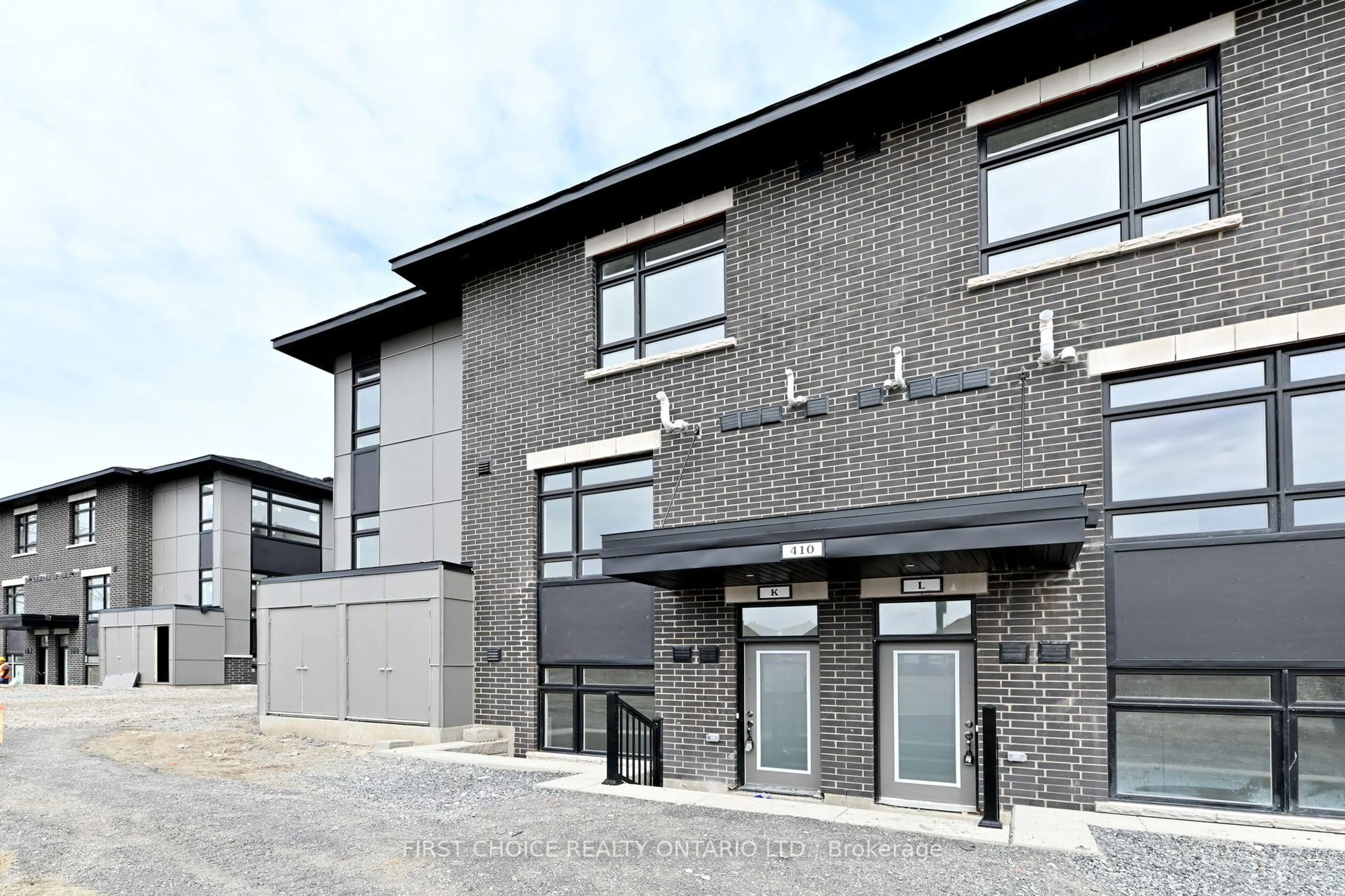 Home with brick exterior material, building for 410 Rolling Meadow Cres #K, Ottawa Ontario K1W 0S1