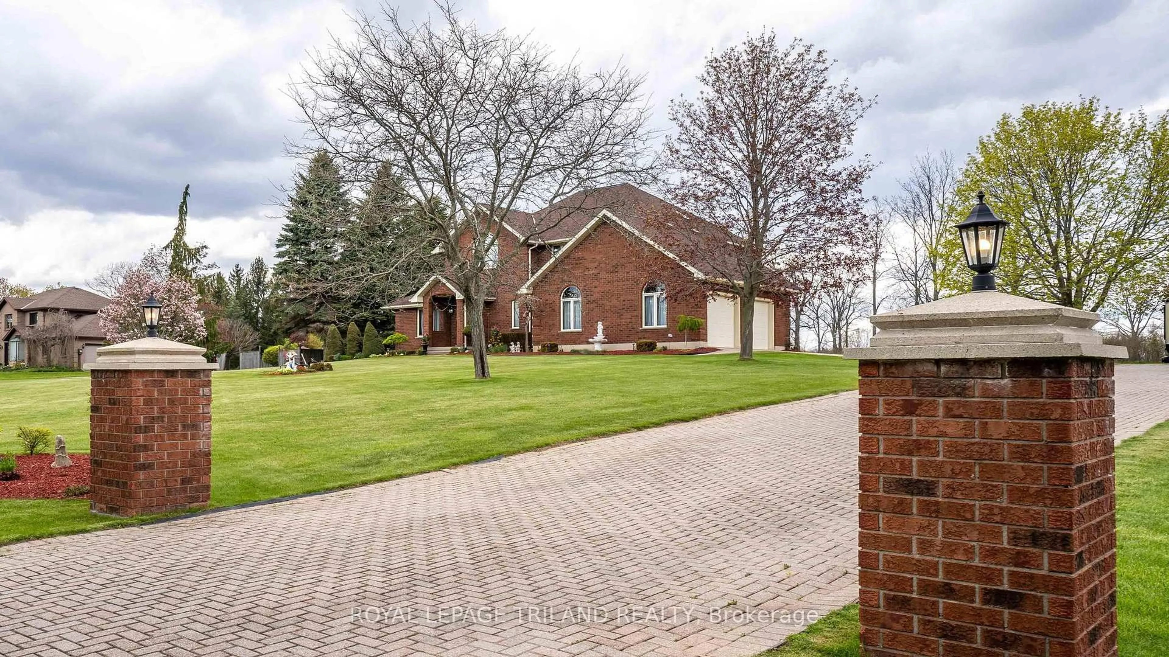 Home with brick exterior material, street for 42720 MEADOW WOOD Lane, Central Elgin Ontario N0L 2L0