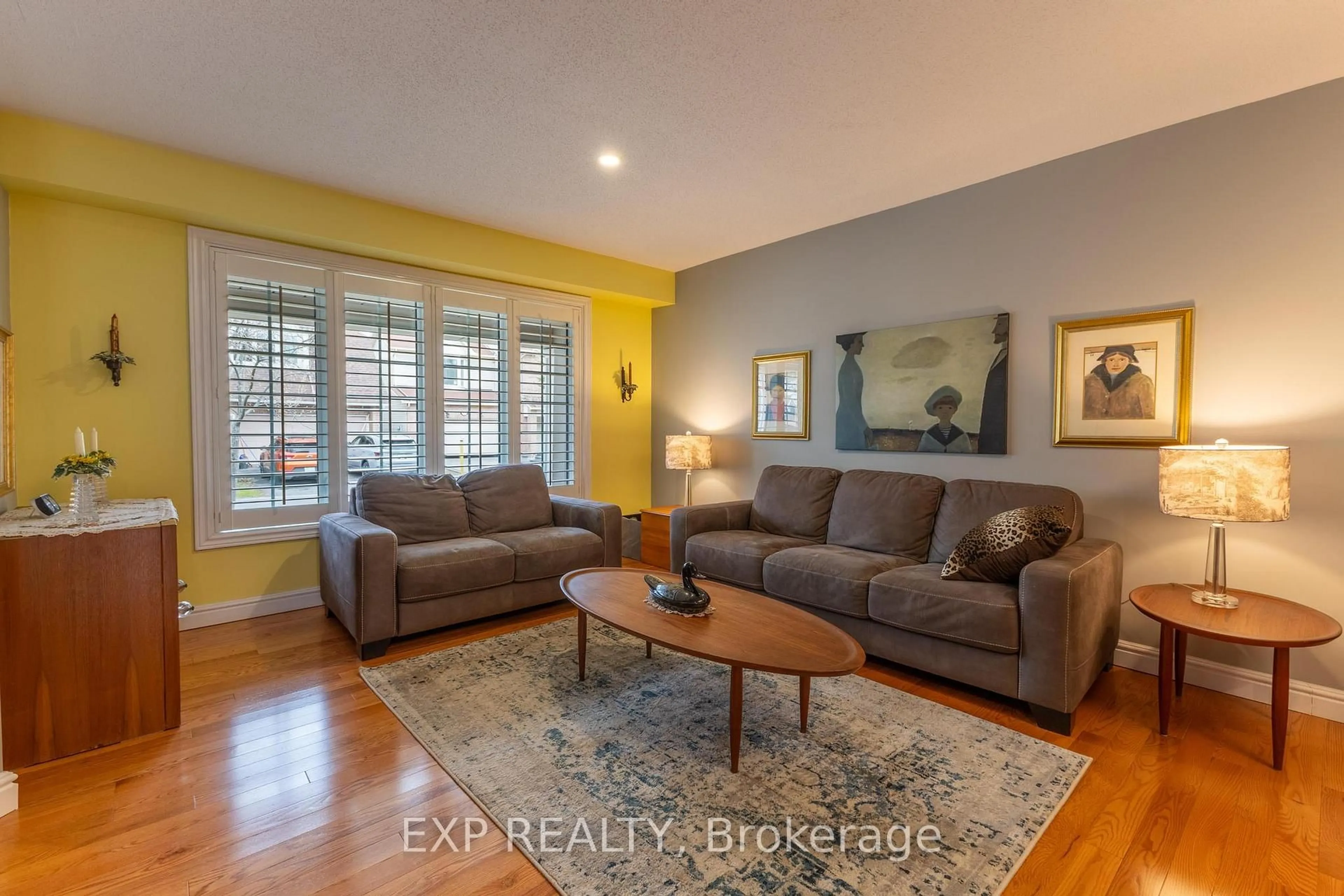 Living room with furniture, wood/laminate floor for 32 Stonepointe Ave, Ottawa Ontario K2G 6G4