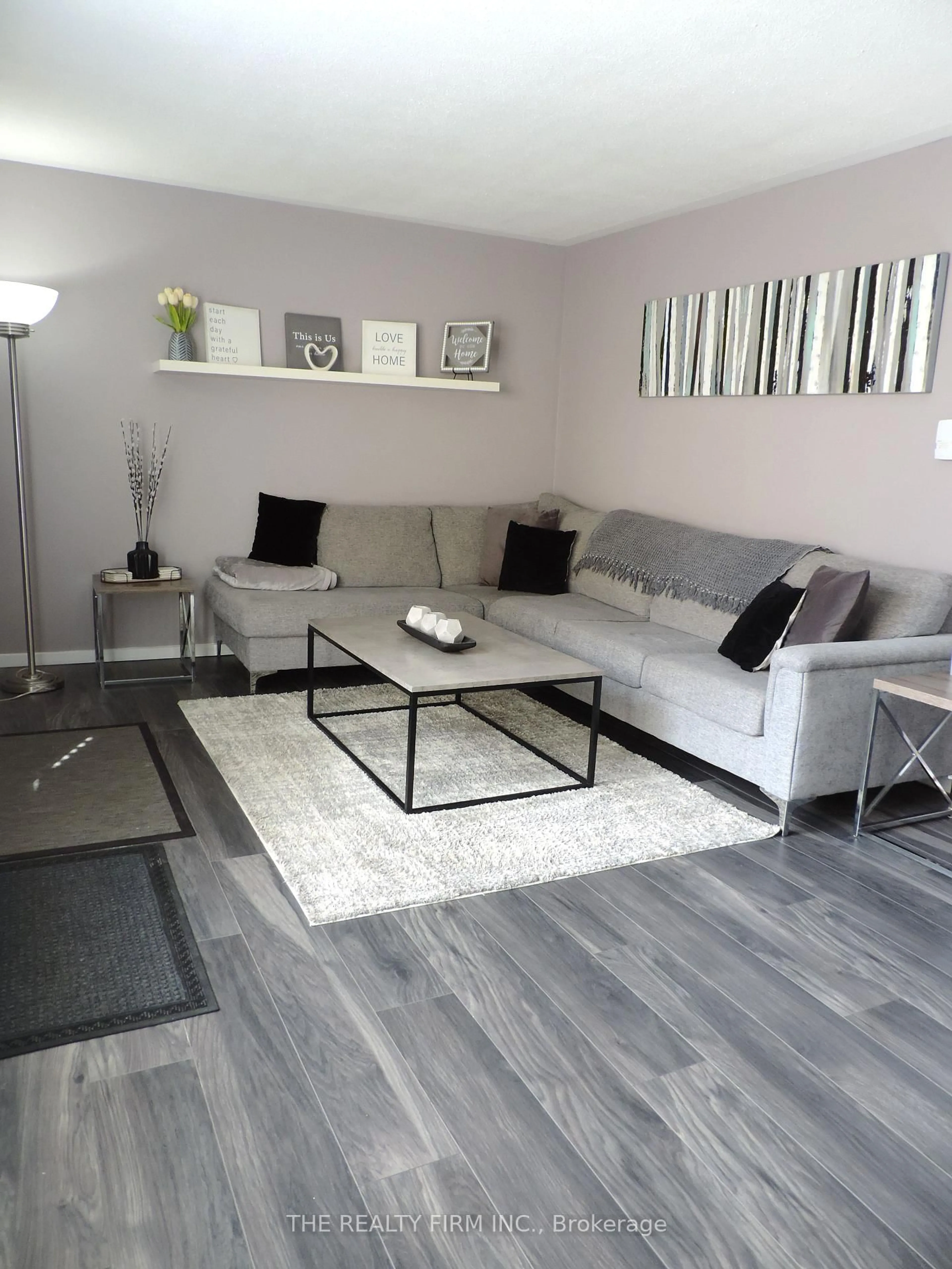 Living room with furniture, wood/laminate floor for 474 Southdale Rd #33, London South Ontario N6E 1A4
