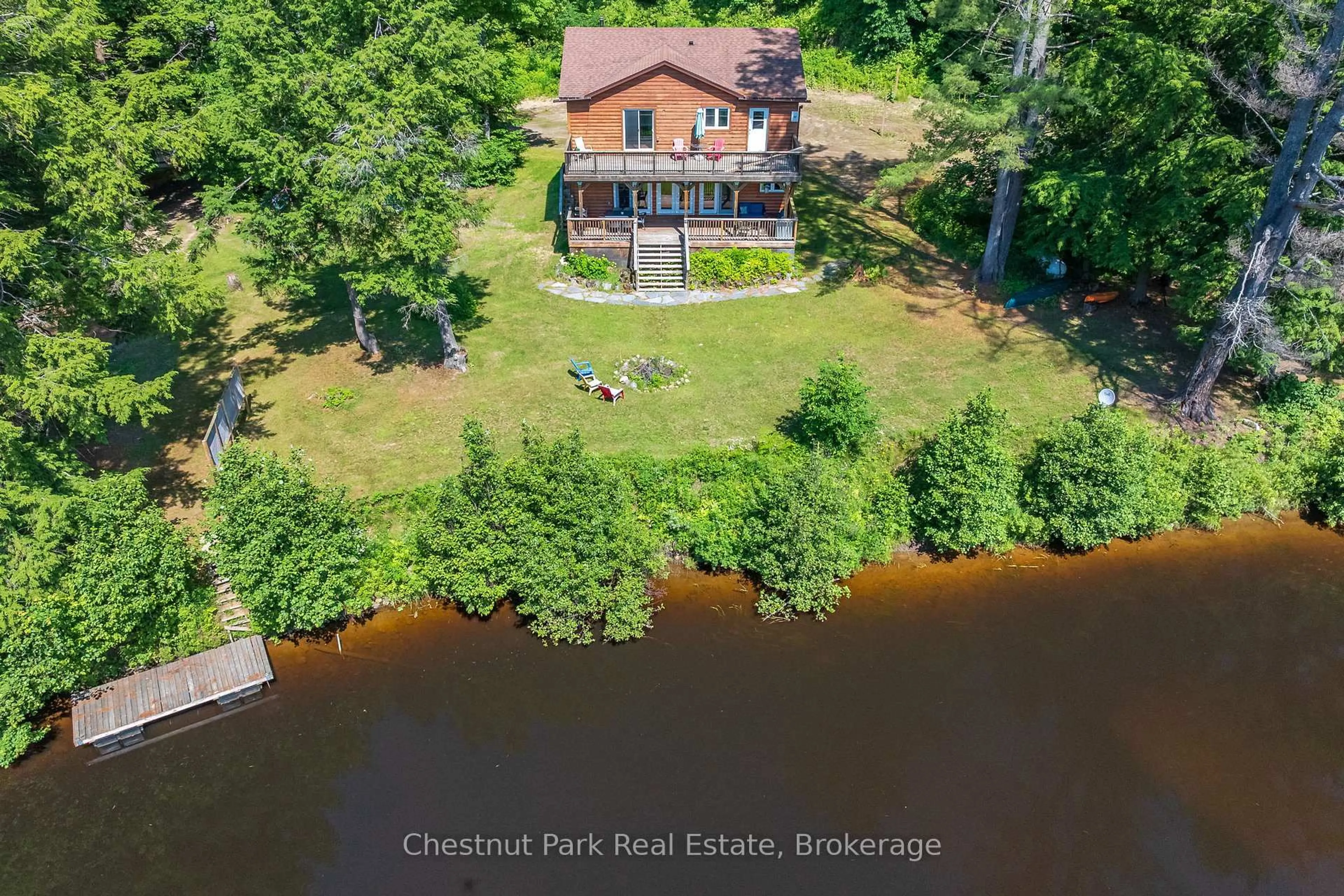 A pic from outside/outdoor area/front of a property/back of a property/a pic from drone, water/lake/river/ocean view for 66 Bridgeview Lane, Huntsville Ontario P1H 2N5