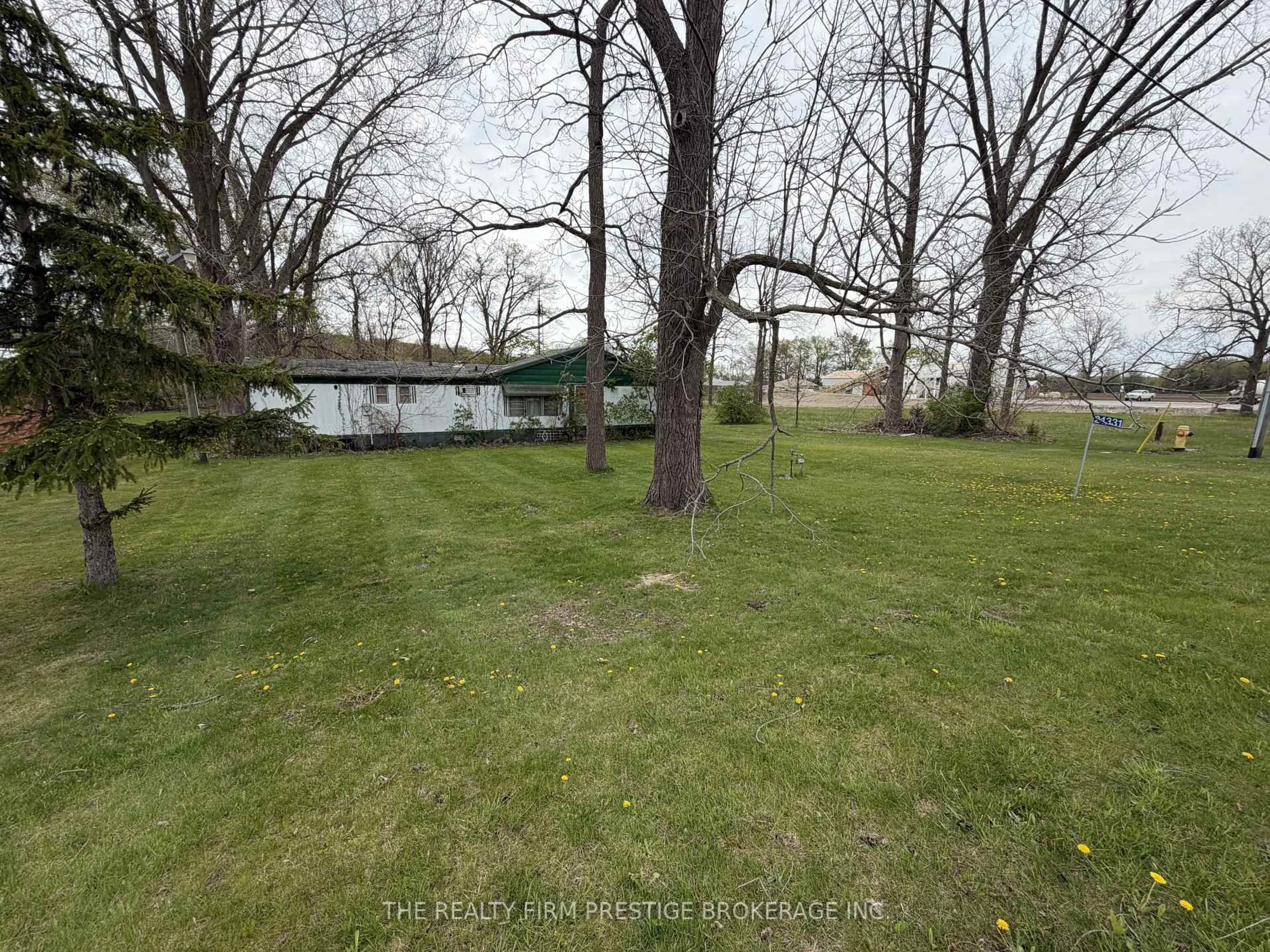 A pic from outside/outdoor area/front of a property/back of a property/a pic from drone, forest/trees view for 24331 Pioneer Line, West Elgin Ontario N0L 2P0