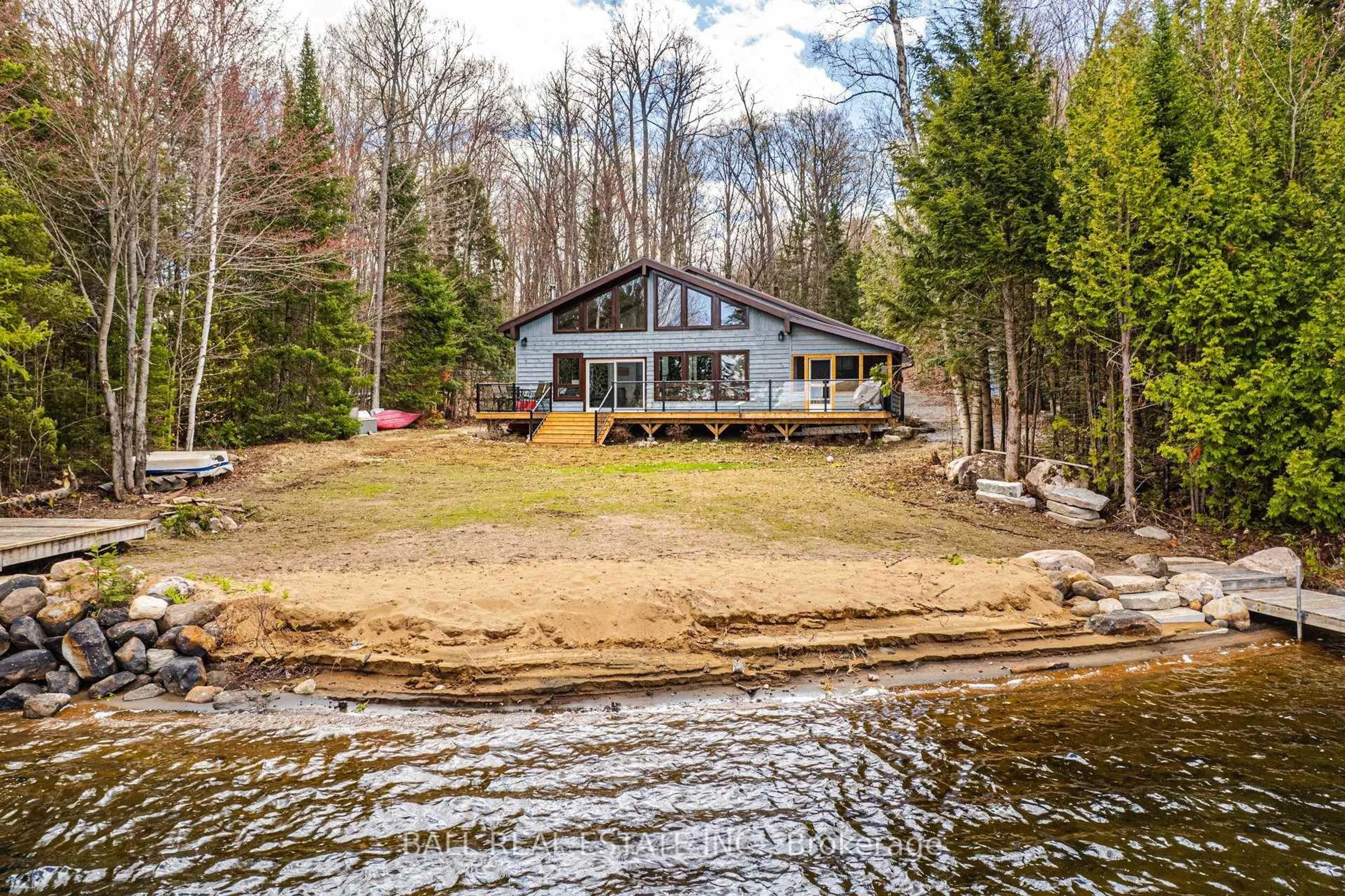 A pic from outside/outdoor area/front of a property/back of a property/a pic from drone, water/lake/river/ocean view for 1154 Surveyor Dr, Highlands East Ontario K0L 2Y0