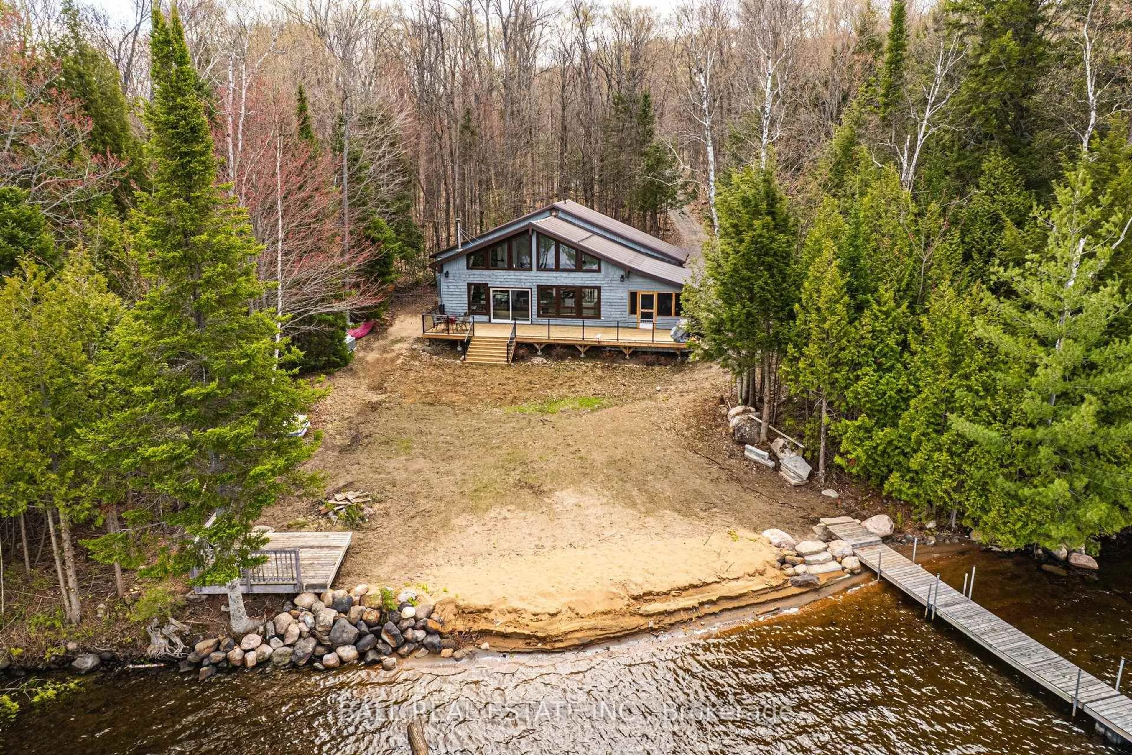 A pic from outside/outdoor area/front of a property/back of a property/a pic from drone, water/lake/river/ocean view for 1154 Surveyor Dr, Highlands East Ontario K0L 2Y0